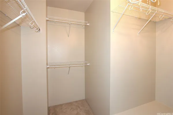 a bathroom with a sink double vanity granite tub shower and a mirror