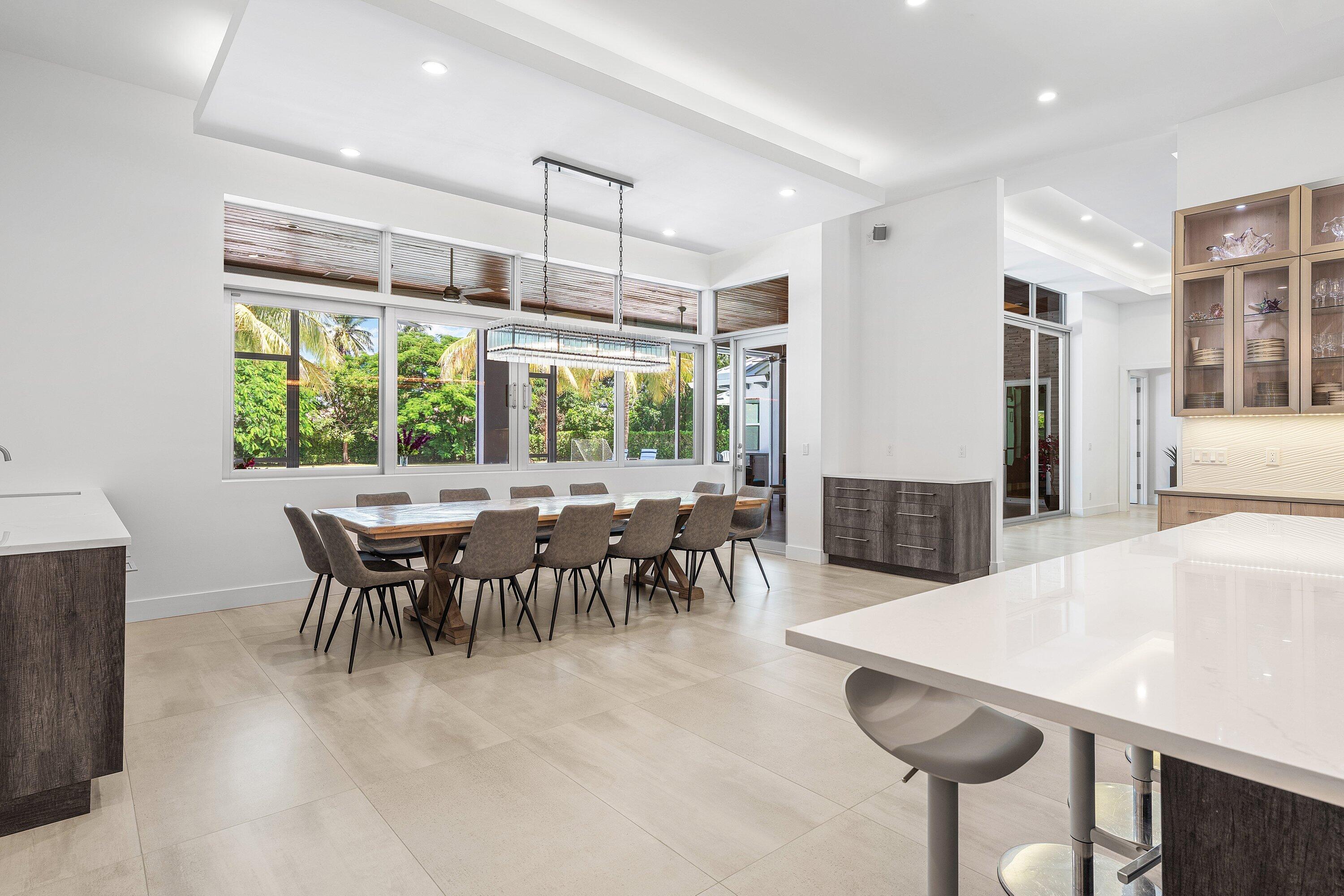 17664 Fieldbrook Circle East Boca Raton, FL 33496 - Photo 20 of 90 a dining room with furniture a chandelier and a table