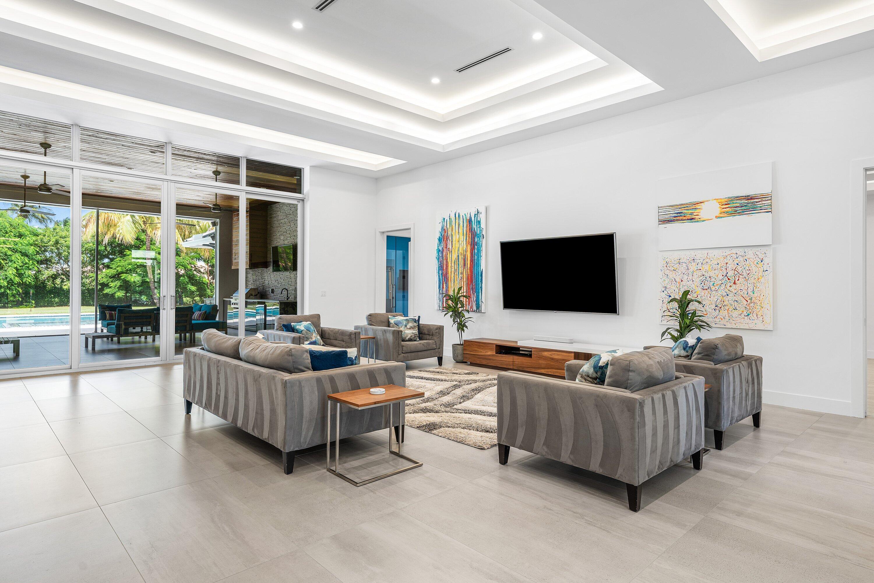 17664 Fieldbrook Circle East Boca Raton, FL 33496 - Photo 25 of 90 a living room with furniture and a flat screen tv