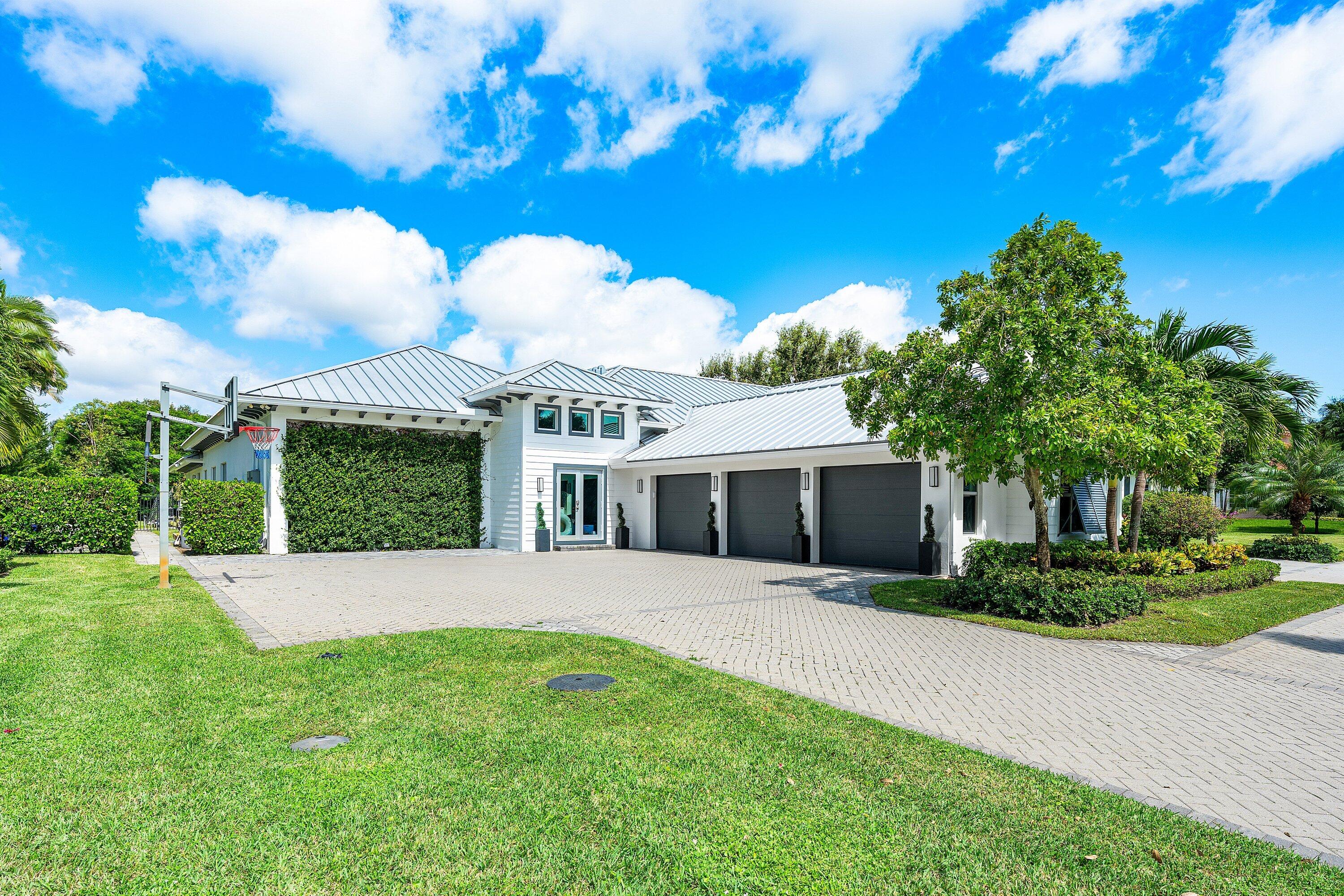 17664 Fieldbrook Circle East Boca Raton, FL 33496 - Photo 4 of 90 a front view of a house with a yard and potted plants