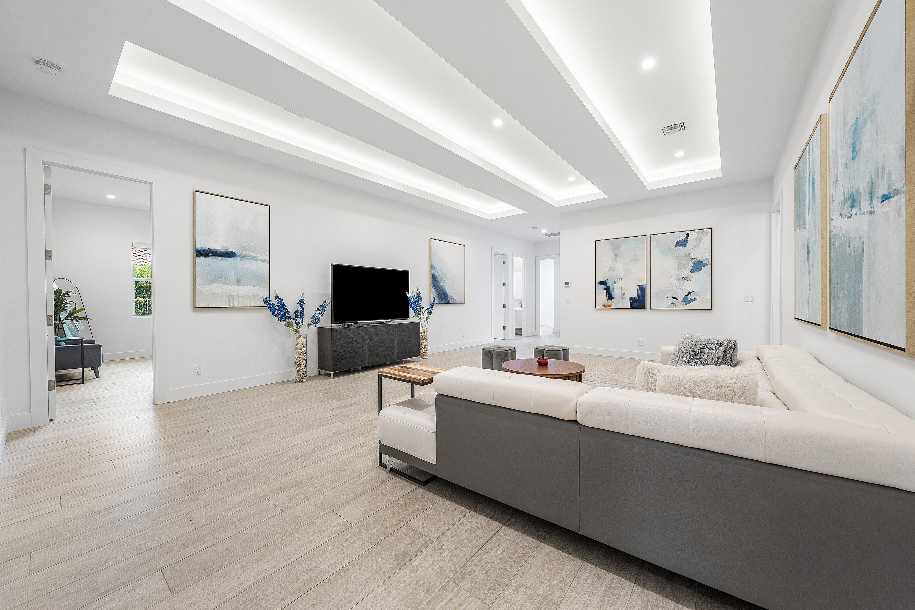 17664 Fieldbrook Circle East Boca Raton, FL 33496 - Photo 49 of 90 a living room with furniture and a flat screen tv