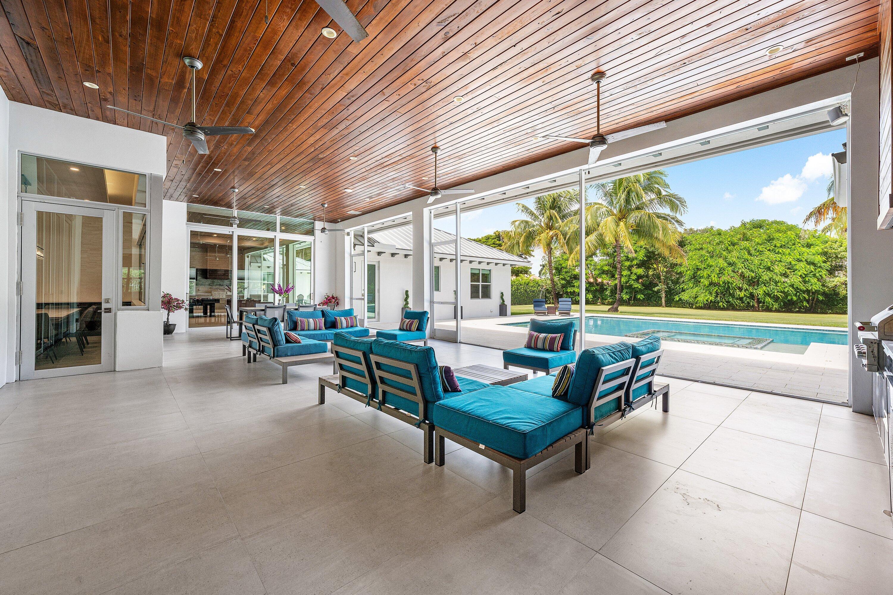 17664 Fieldbrook Circle East Boca Raton, FL 33496 - Photo 70 of 90 a living room with patio furniture and a large window