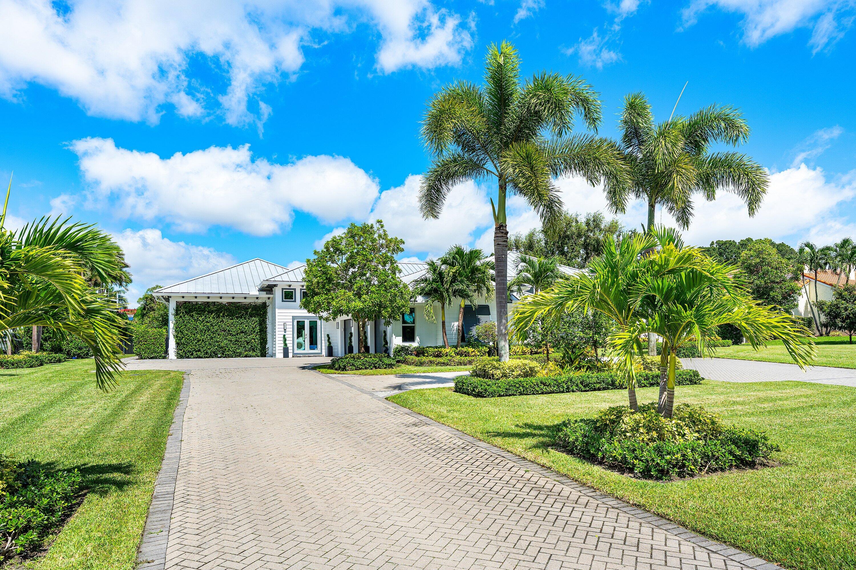 17664 Fieldbrook Circle East Boca Raton, FL 33496 - Photo 8 of 90 a front view of a house with a yard and trees