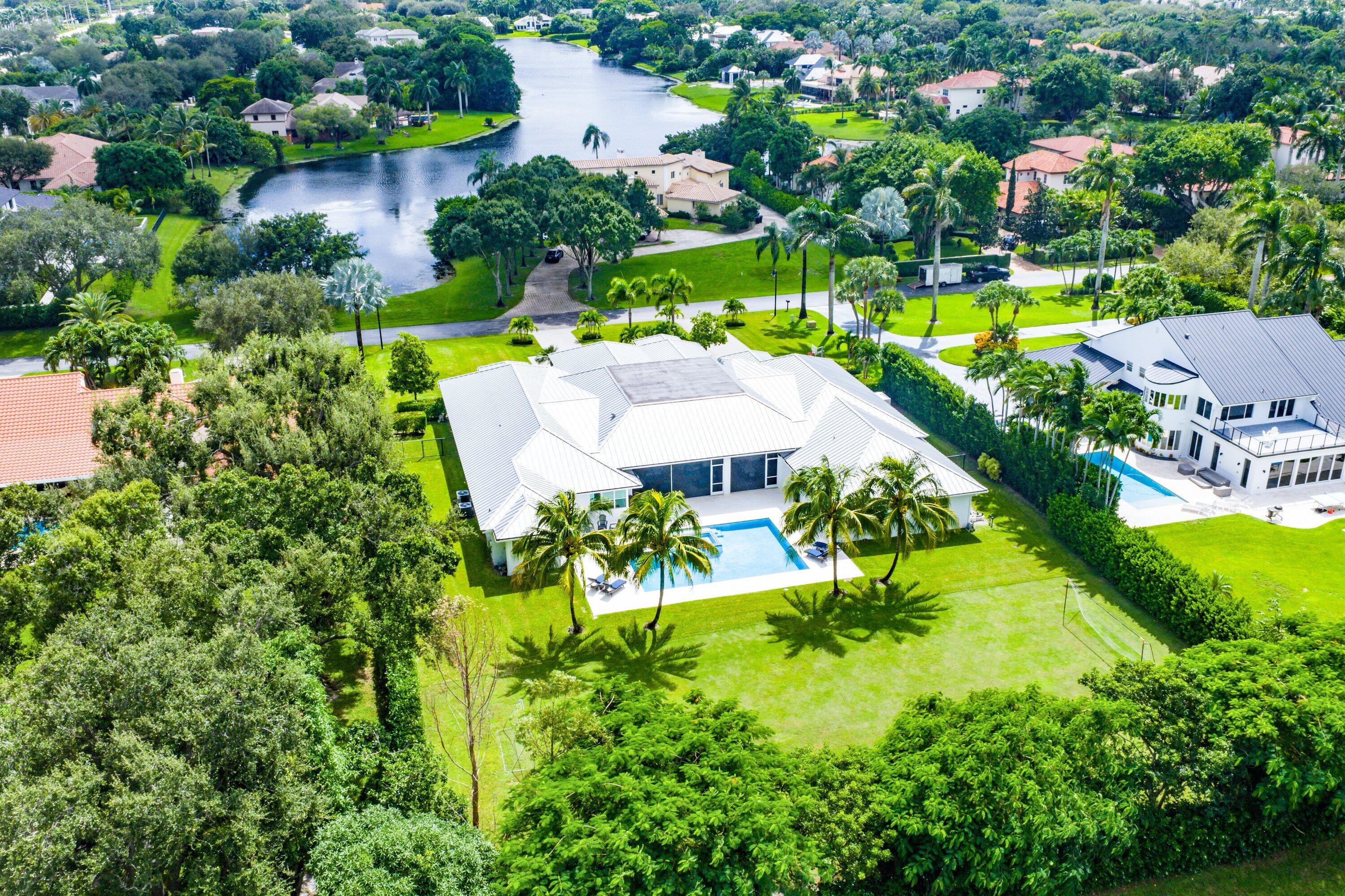 17664 Fieldbrook Circle East Boca Raton, FL 33496 - Photo 85 of 90 an aerial view of a house with swimming pool a yard and lake view