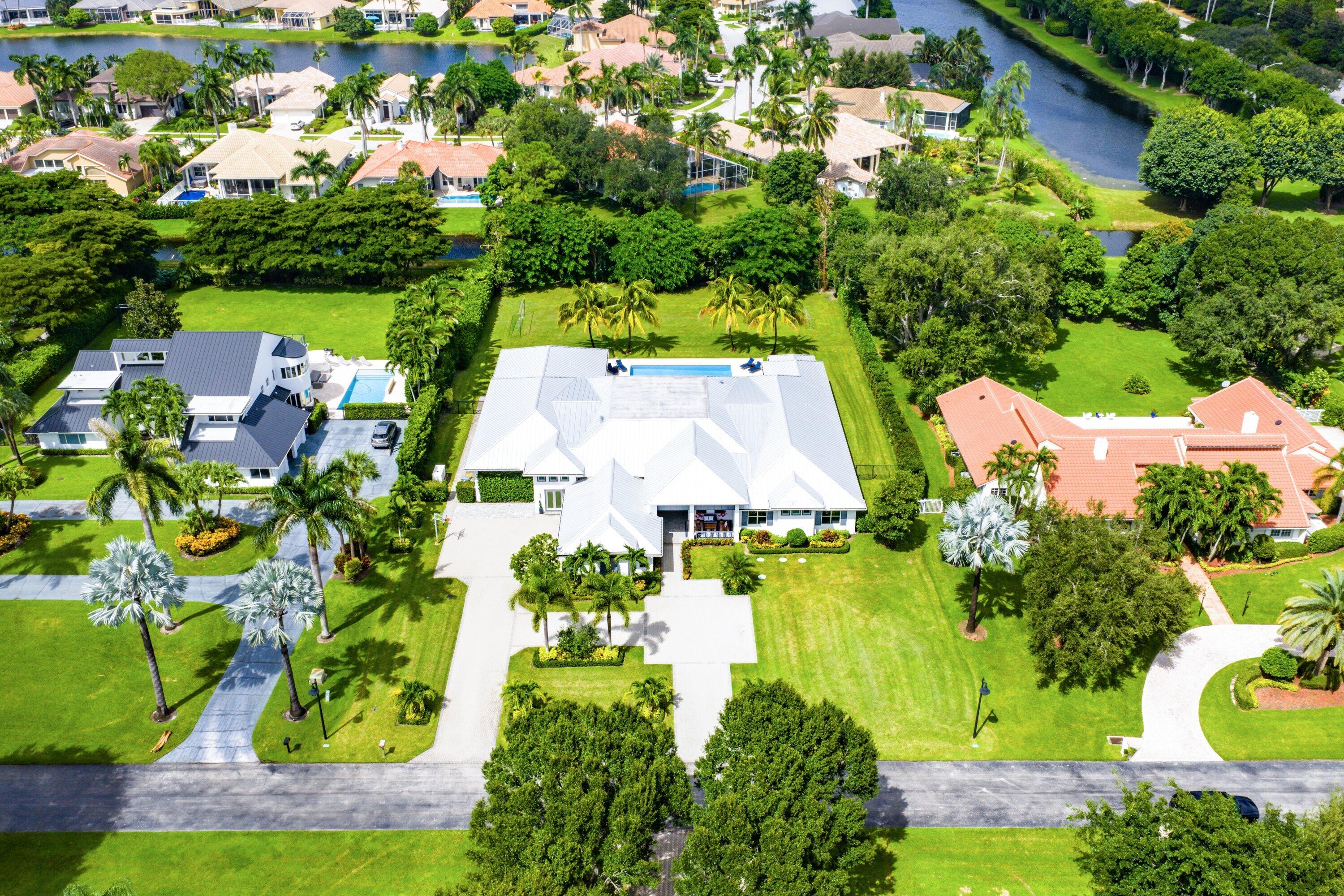 17664 Fieldbrook Circle East Boca Raton, FL 33496 - Photo 88 of 90 an aerial view of a house with a garden and lake view