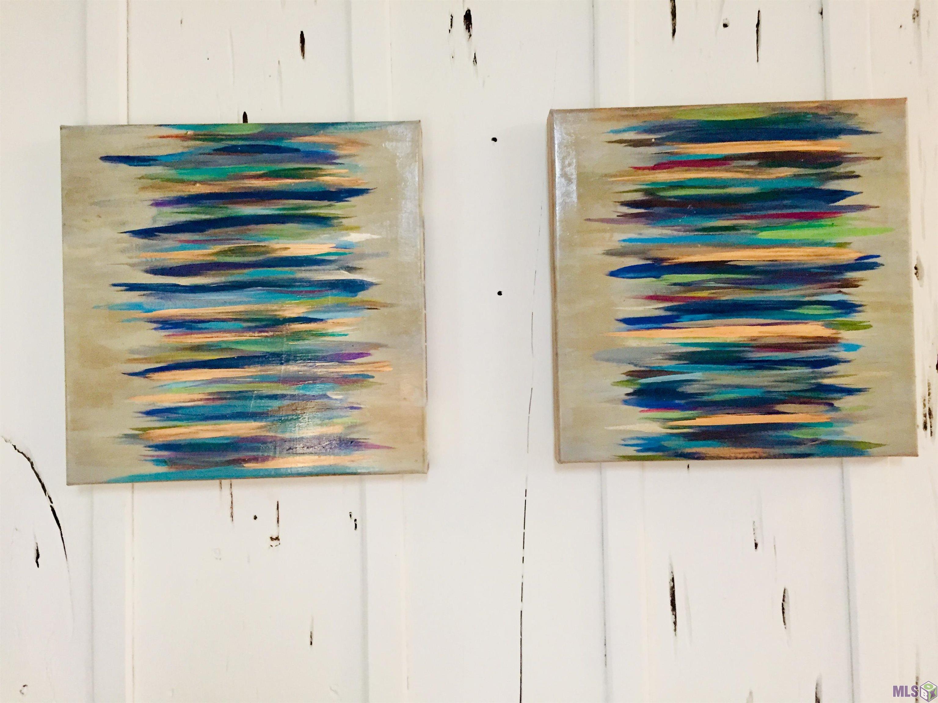 879 South Eugene Street, Unit 4 Baton Rouge, LA 70806 - Photo 19 of 39 Caribbean art displayed on Pecky Cypress walls.