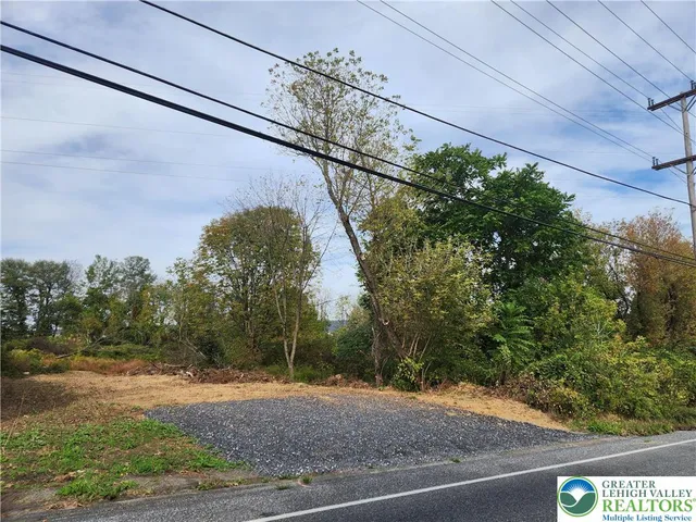 a view of a street with a building in the background