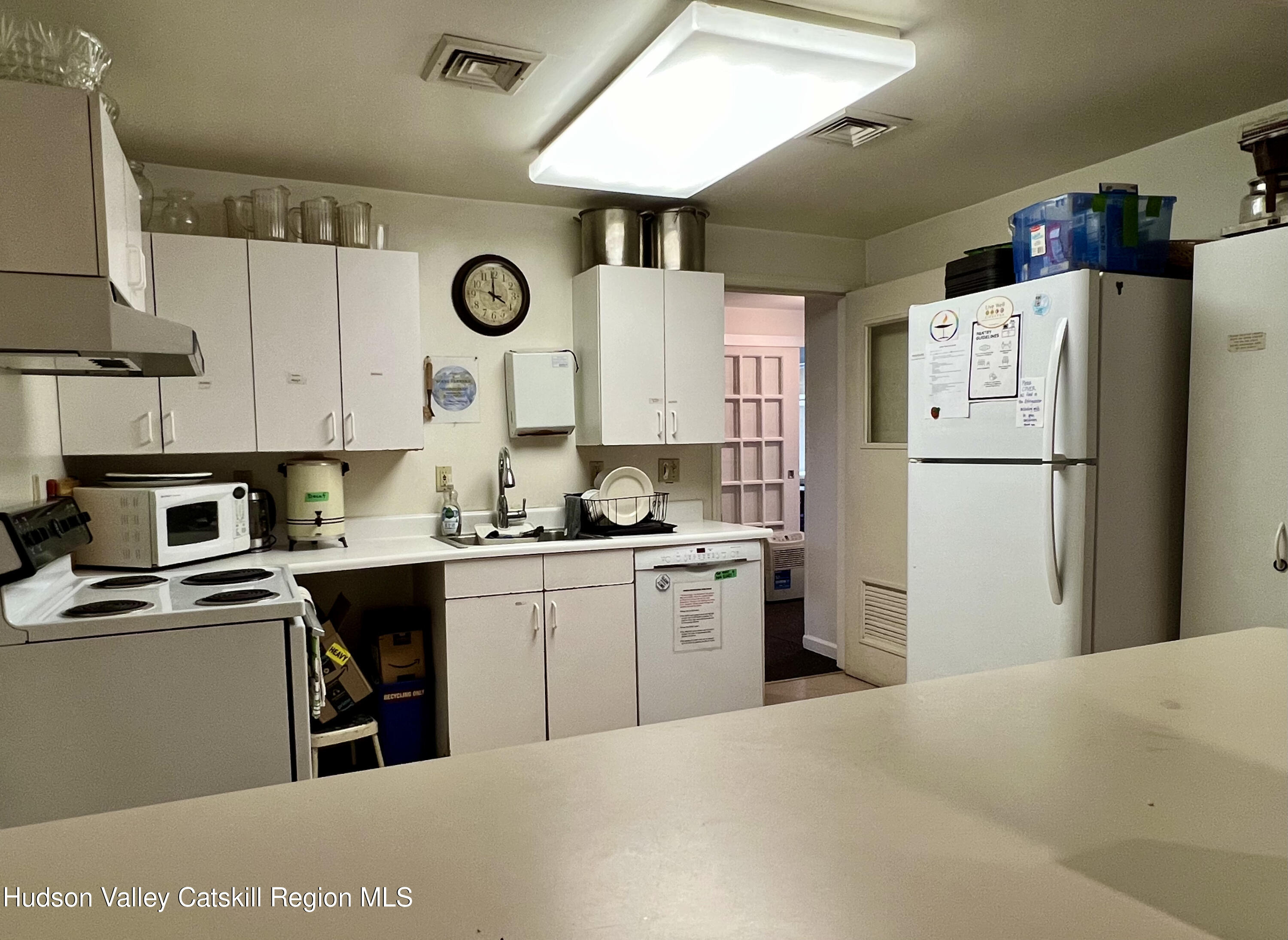 320 Sawkill Road Kingston, NY 12401 - Photo 18 of 45 a kitchen with a refrigerator a stove a sink and a cabinets
