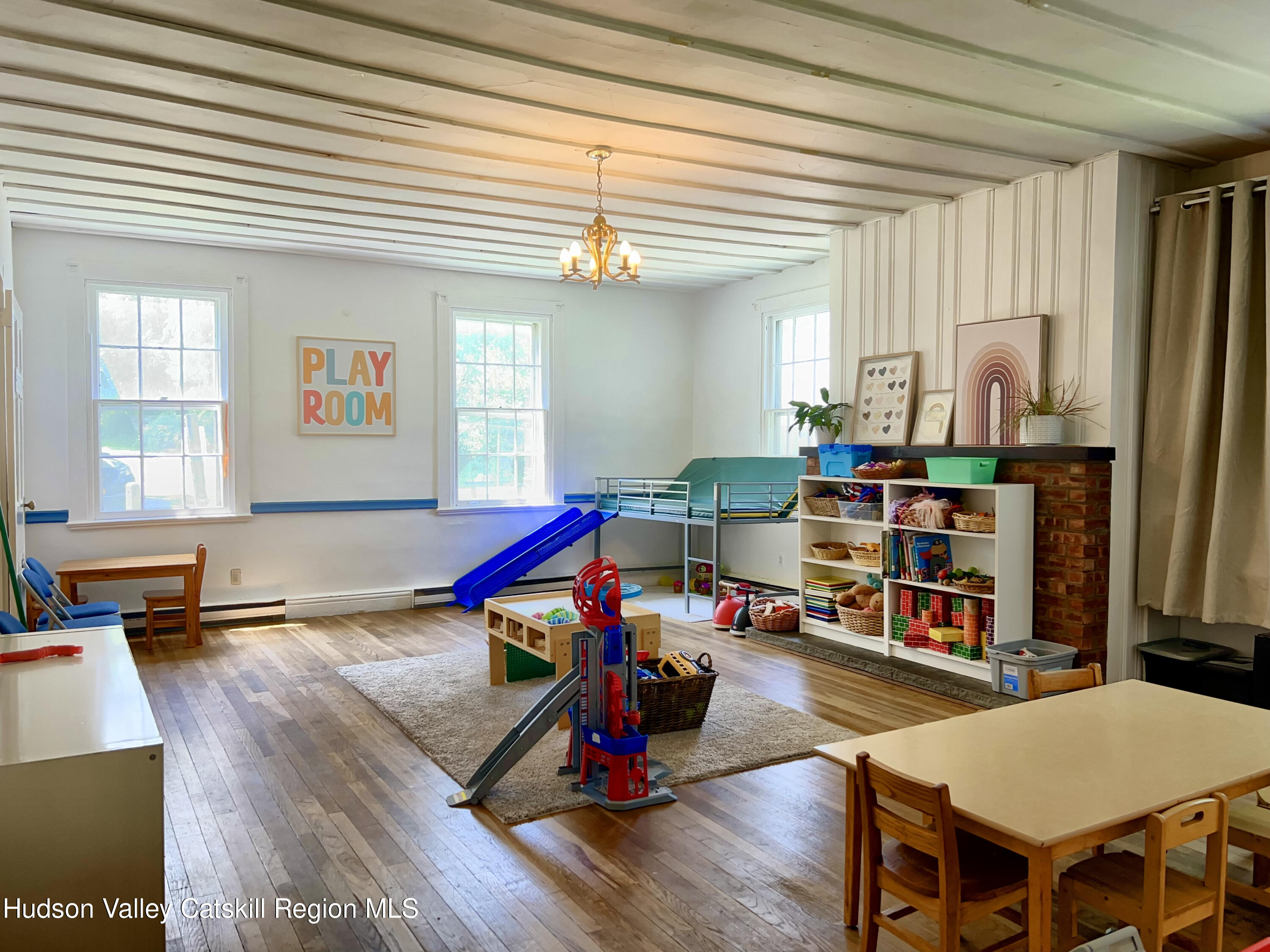 320 Sawkill Road Kingston, NY 12401 - Photo 30 of 45 a living room with furniture a rug and a wooden floor