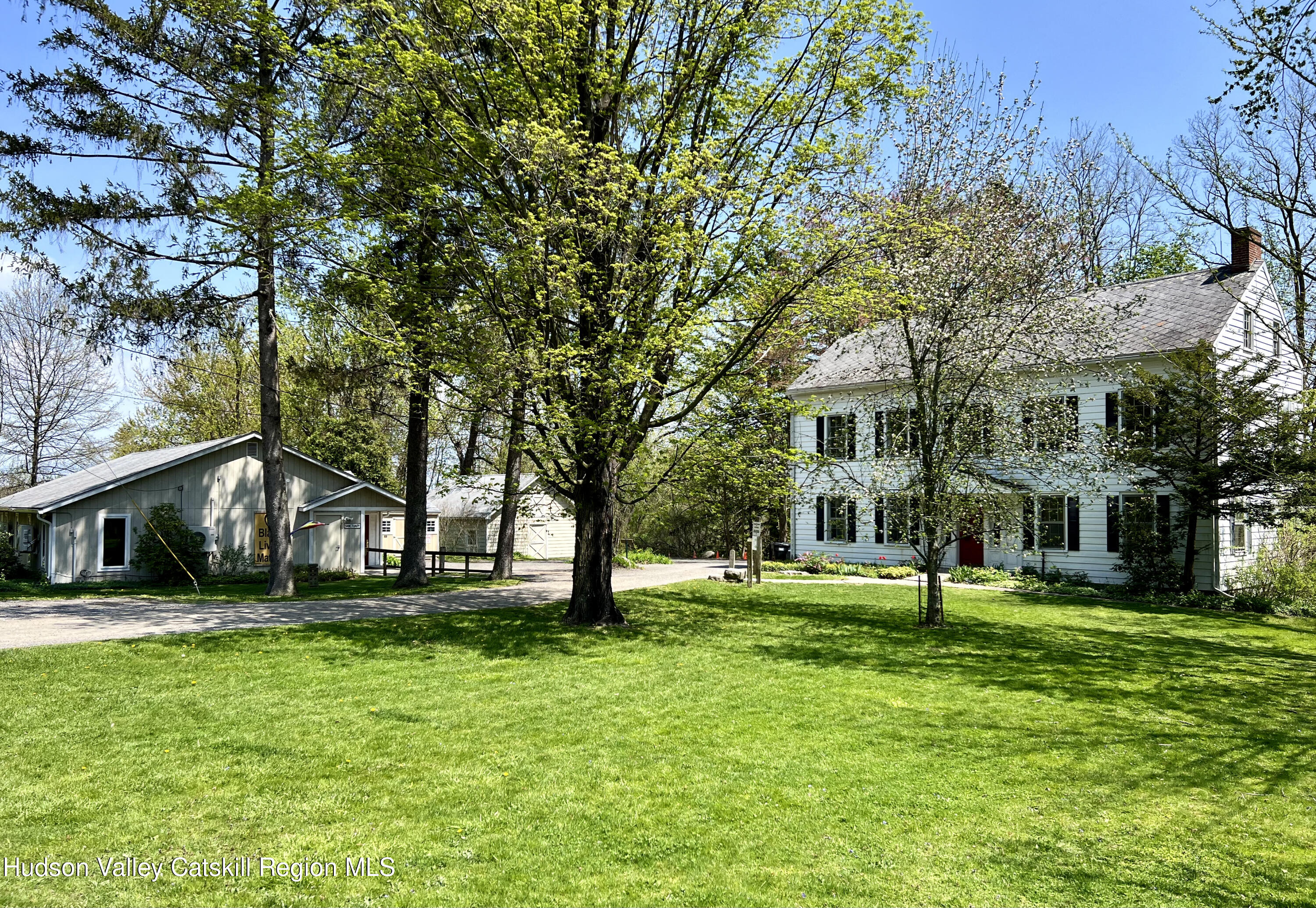 320 Sawkill Road Kingston, NY 12401 - Photo 3 of 45 a front view of a building with a garden