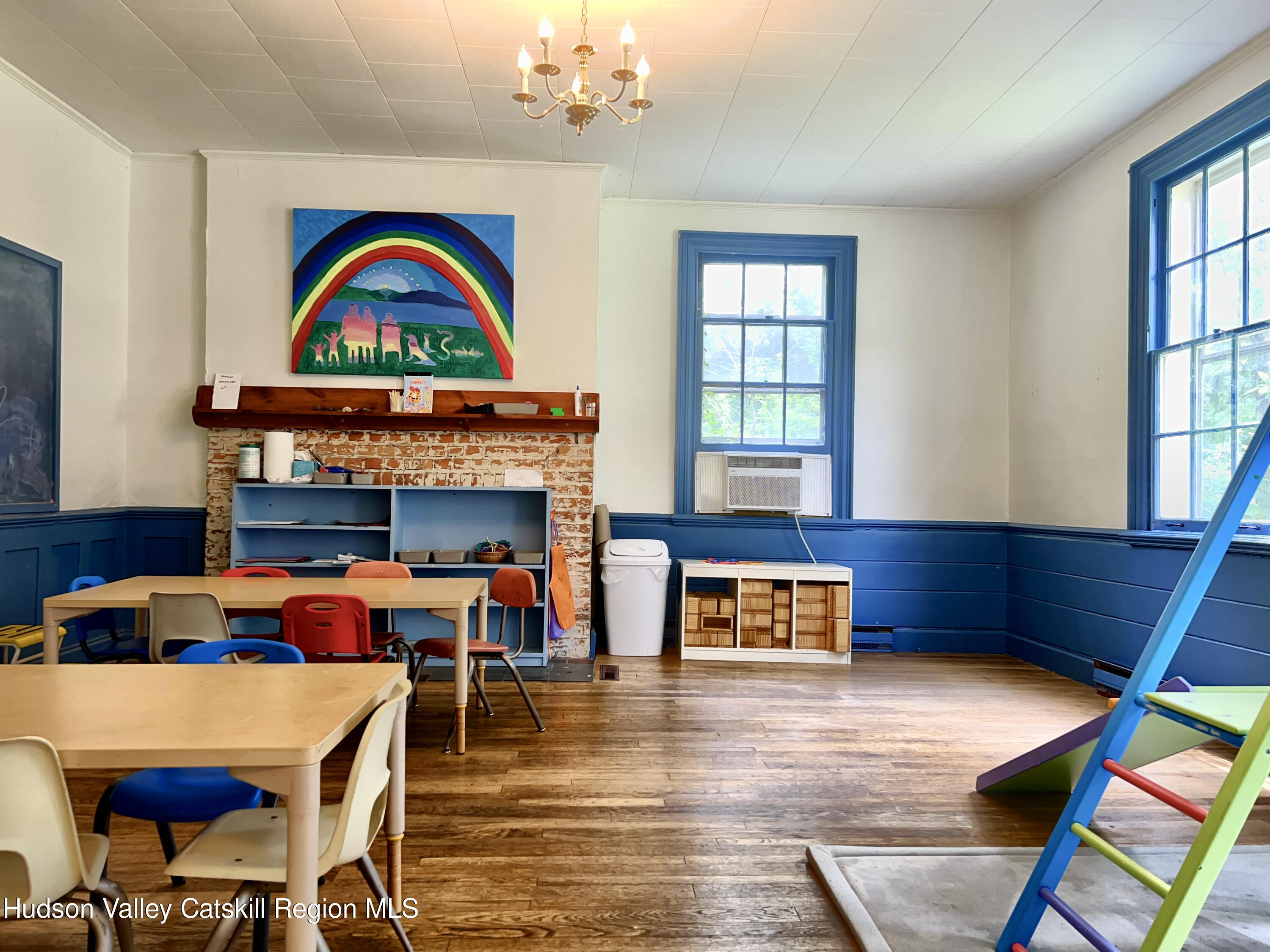 320 Sawkill Road Kingston, NY 12401 - Photo 33 of 45 a living room with furniture a rug and a fireplace