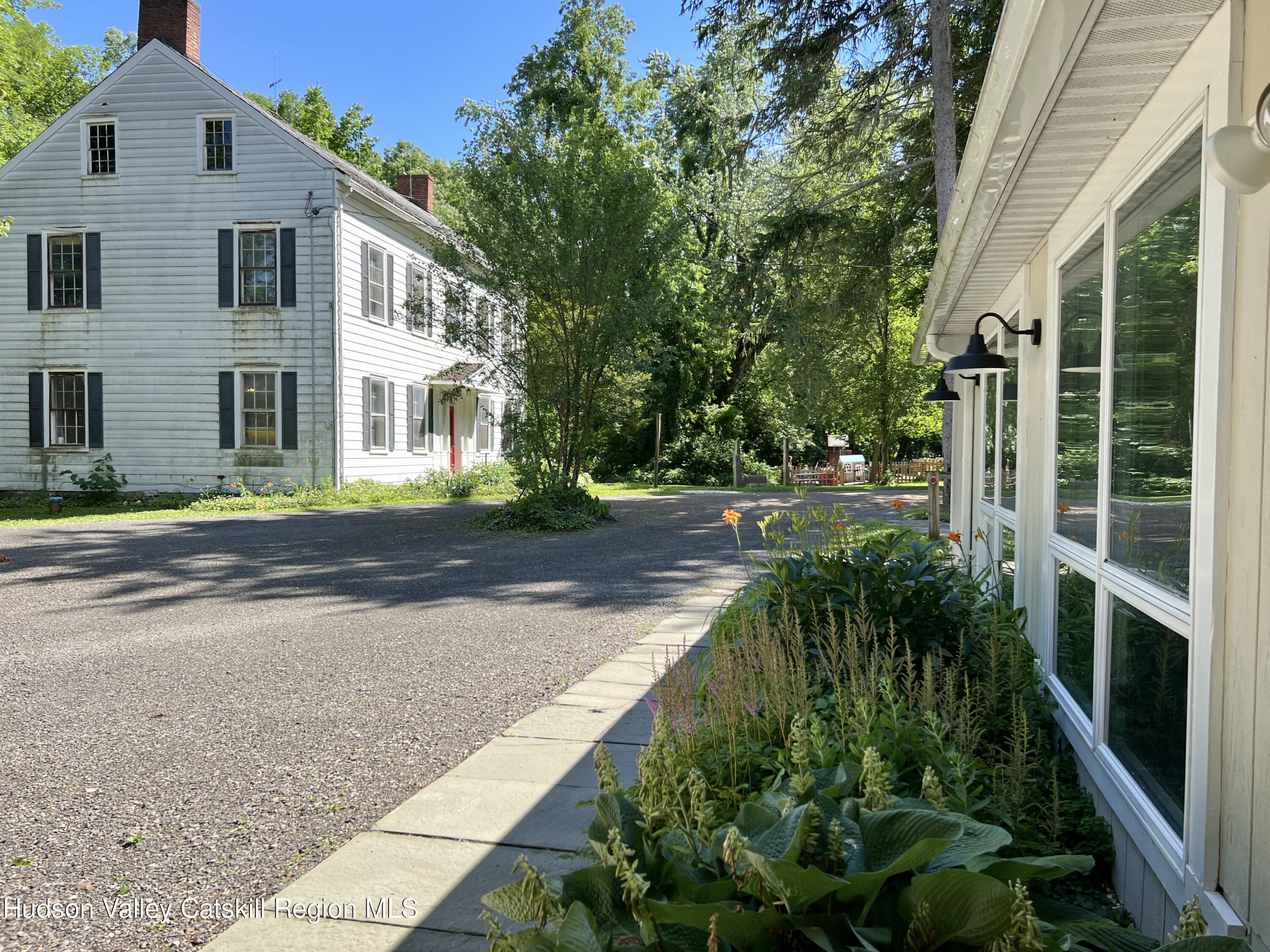 320 Sawkill Road Kingston, NY 12401 - Photo 5 of 45 a front view of a house with a garden