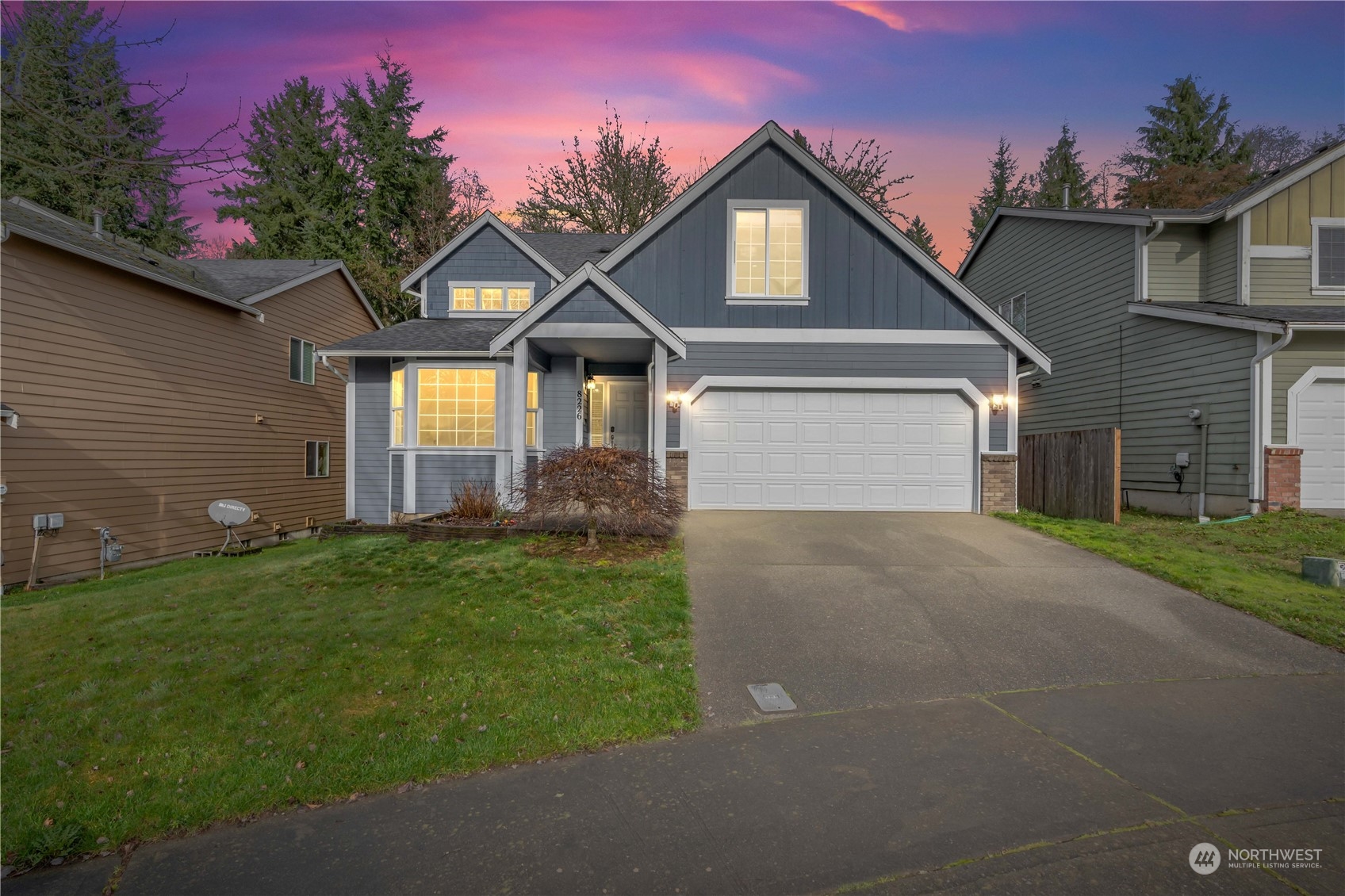 8226 Racca Court Southeast Olympia, WA 98513 - Photo 1 of 40 a front view of a house with a yard and garage