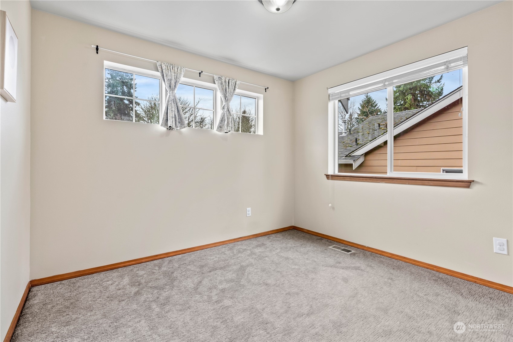 8226 Racca Court Southeast Olympia, WA 98513 - Photo 27 of 40 a view of an empty room with windows