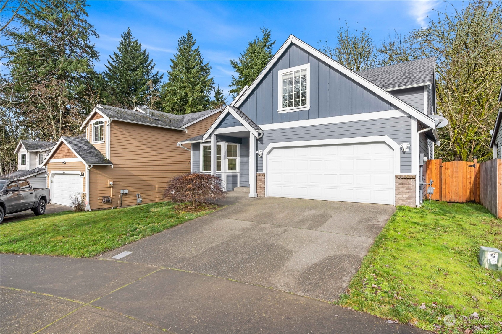 8226 Racca Court Southeast Olympia, WA 98513 - Photo 32 of 40 a front view of a house with a yard and garage