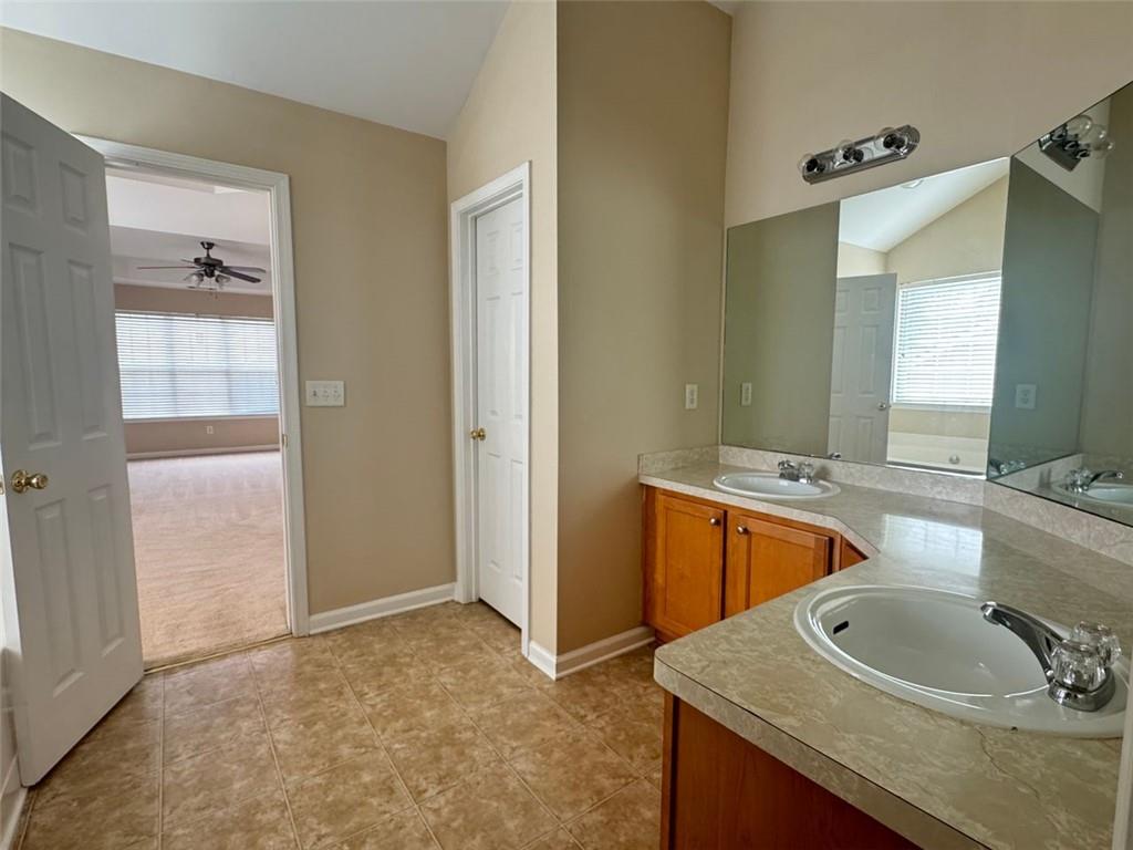 5432 Village Ridge Fairburn, GA 30213 - Photo 13 of 18 a bathroom with a sink and a mirror