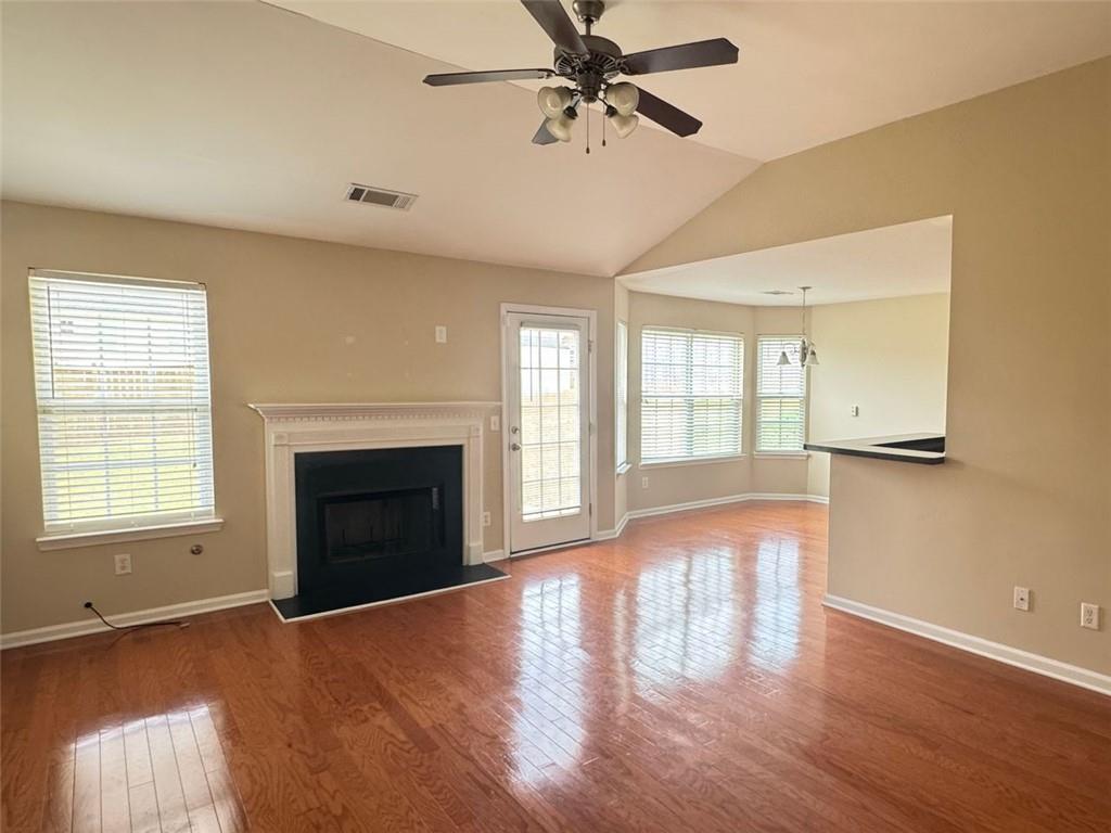 5432 Village Ridge Fairburn, GA 30213 - Photo 4 of 18 a view of an empty room with wooden floor and a window