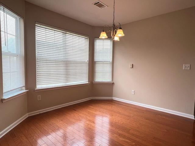 5432 Village Ridge Fairburn, GA 30213 - Photo 6 of 18 an empty room with wooden floor and windows