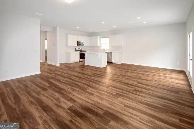 a view of kitchen with wooden floor