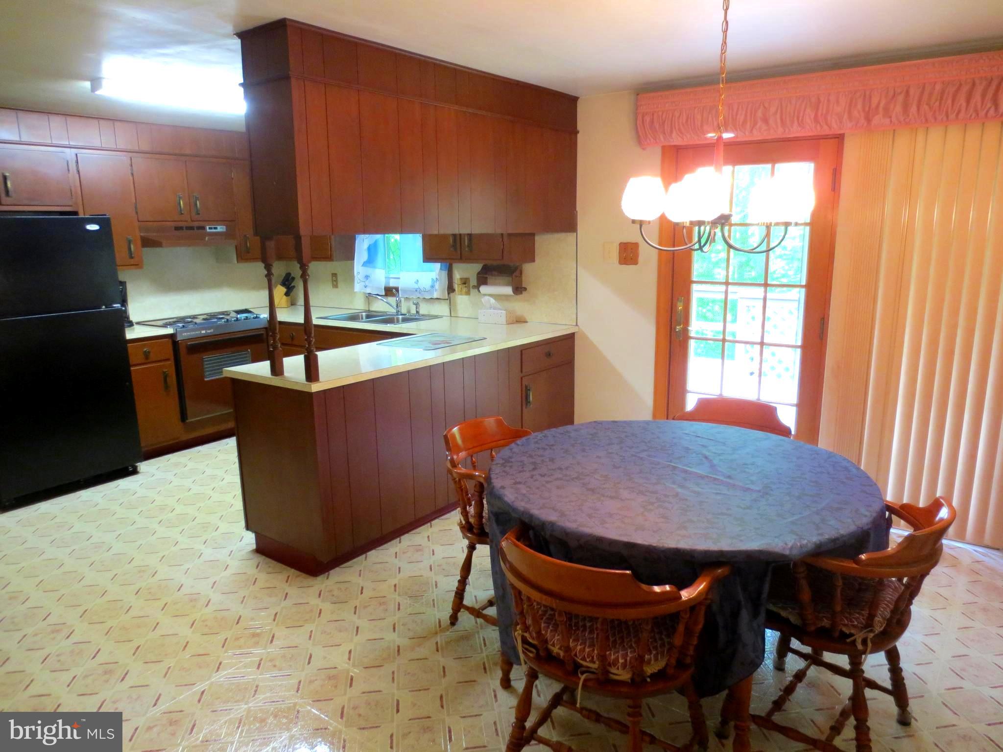 1757 Yarnall Road Pottstown, PA 19464 - Photo 14 of 28 Kitchen/Dining with sliders to Deck