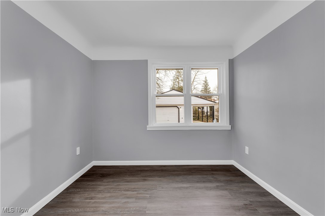 953 Whitby Road Cleveland Heights, OH 44112 - Photo 13 of 27 Unfurnished room featuring dark wood-style floors