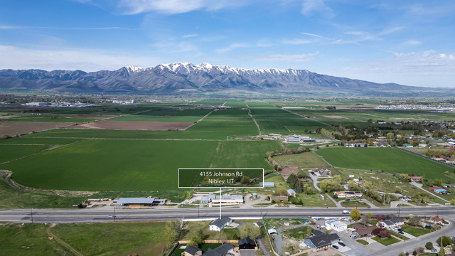 4155 Johnson Road Nibley, UT 84321 - Photo 69 of 71 Aerial view of sparsely populated area featuring a mountain backdrop