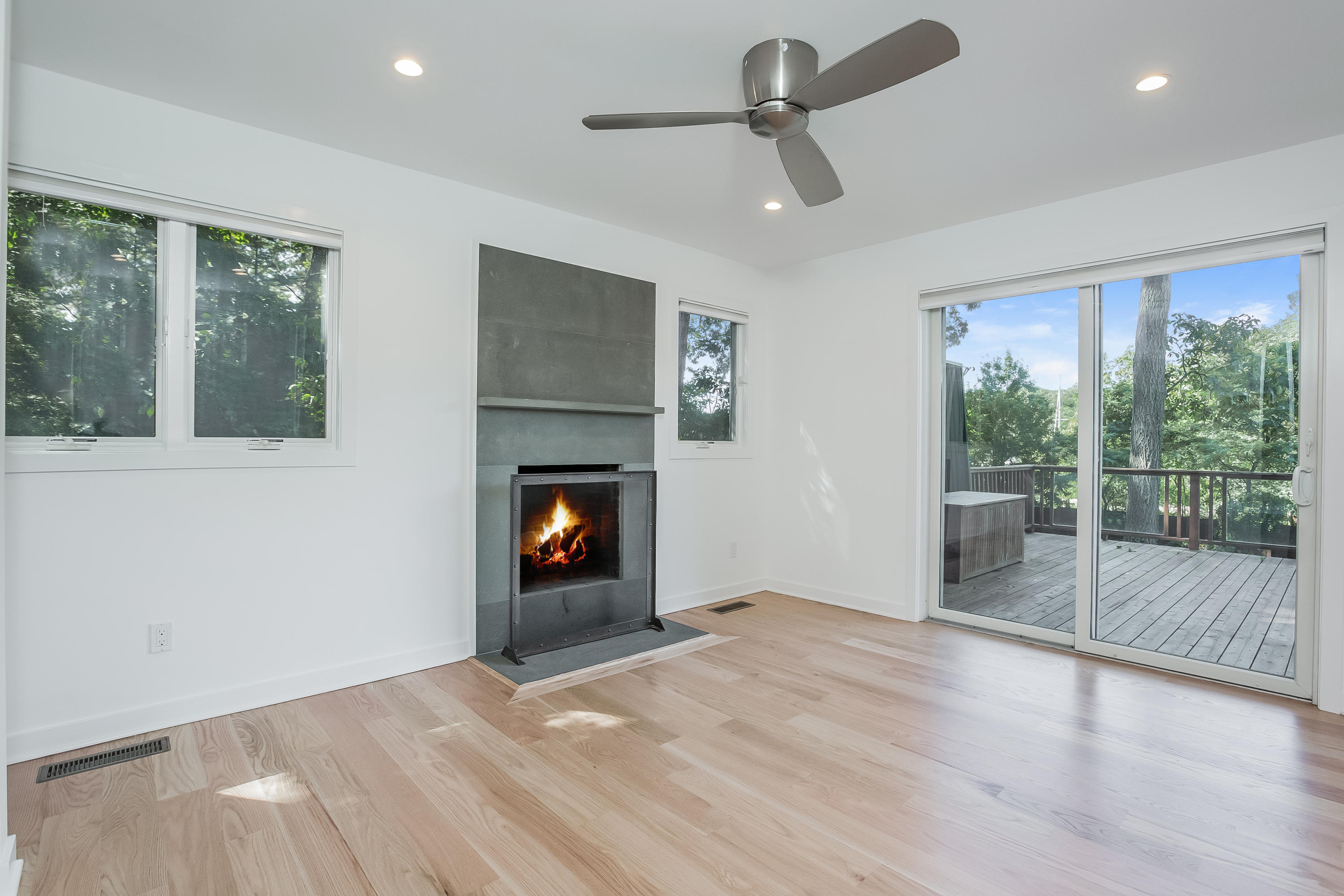 8 Outer Road Norwalk, CT 06854 - Photo 16 of 39 a view of empty room with wooden floor and fireplace