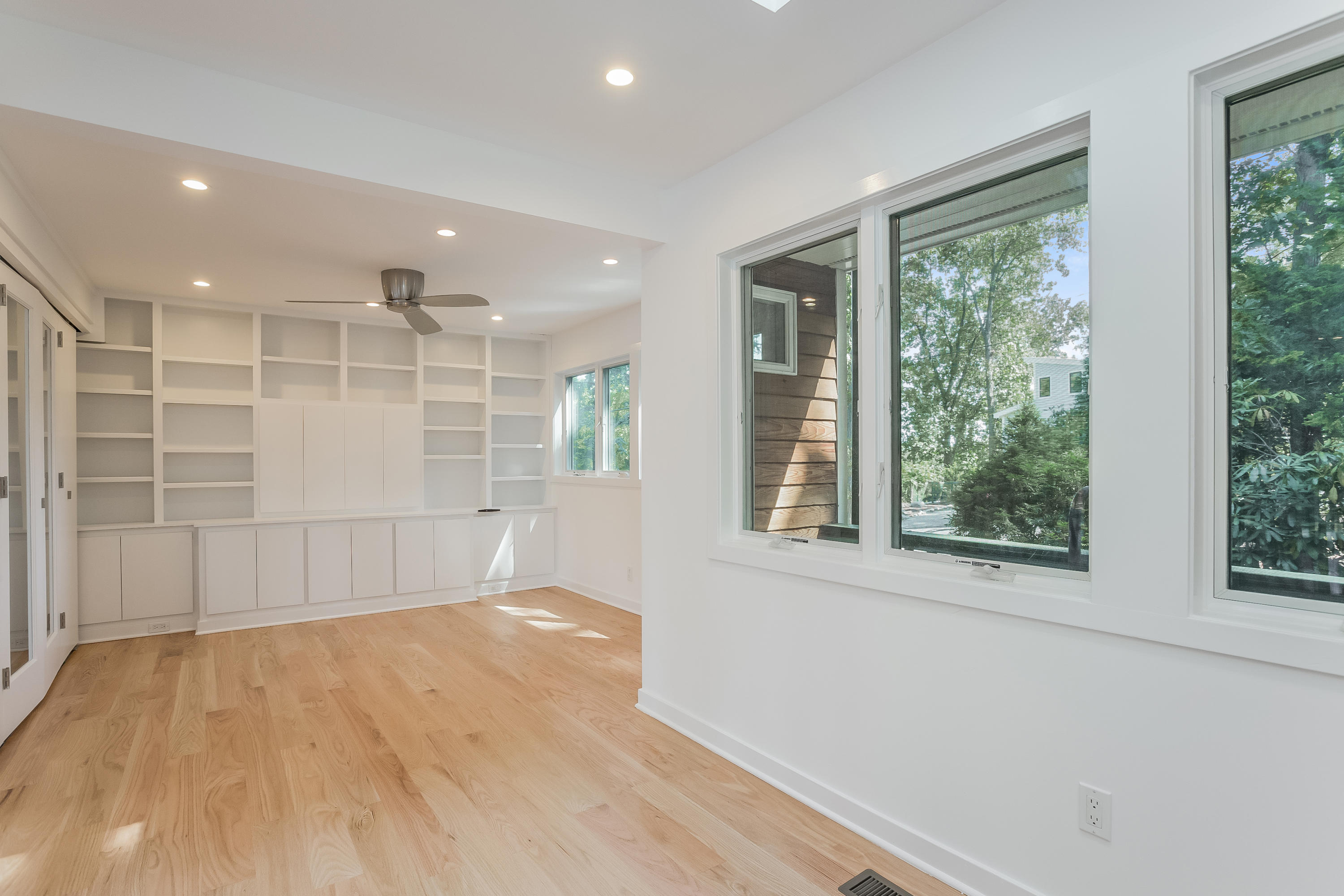 8 Outer Road Norwalk, CT 06854 - Photo 17 of 39 an empty room with wooden floor and windows