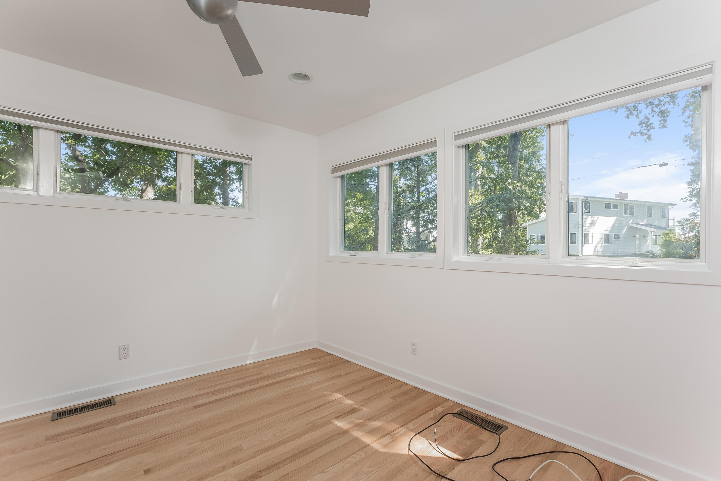 8 Outer Road Norwalk, CT 06854 - Photo 25 of 39 a view of empty room with wooden floor and fan