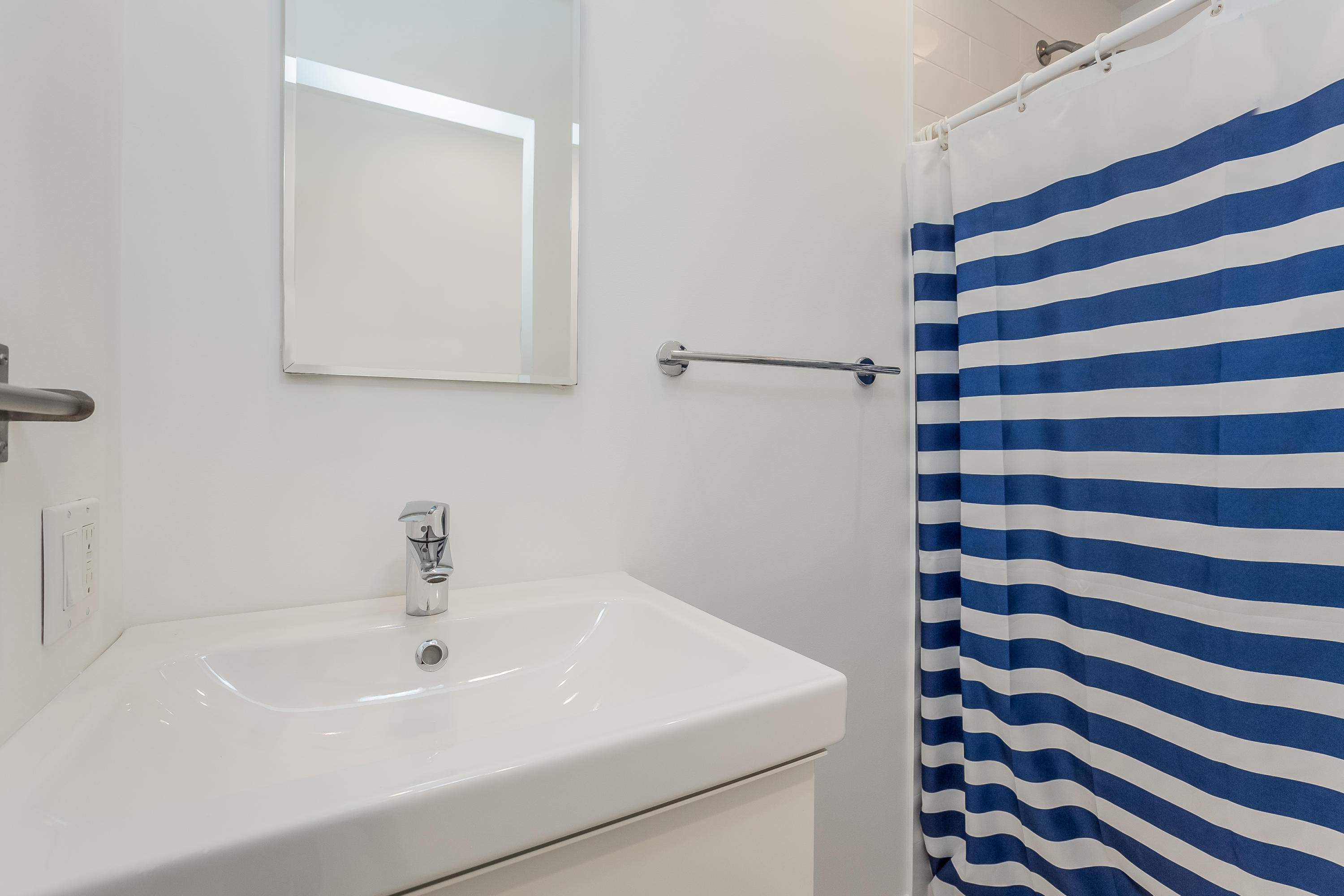 8 Outer Road Norwalk, CT 06854 - Photo 26 of 39 a bathroom with a sink and a mirror