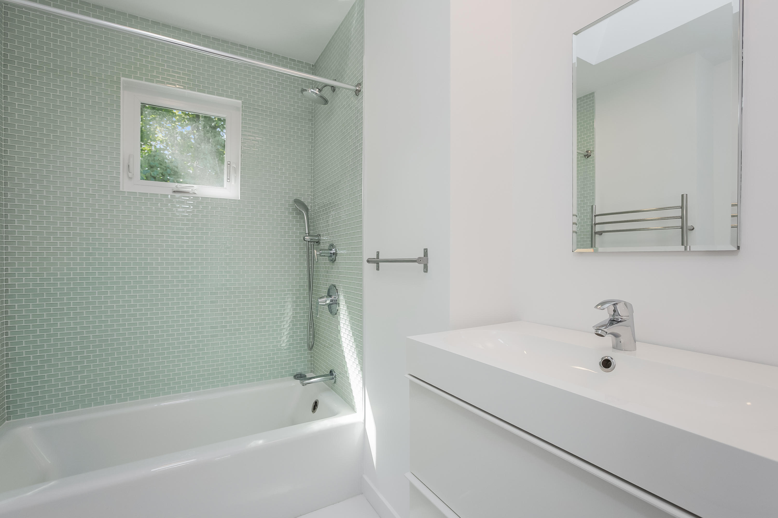 8 Outer Road Norwalk, CT 06854 - Photo 29 of 39 a white bath tub sitting next to a white sink and vanity