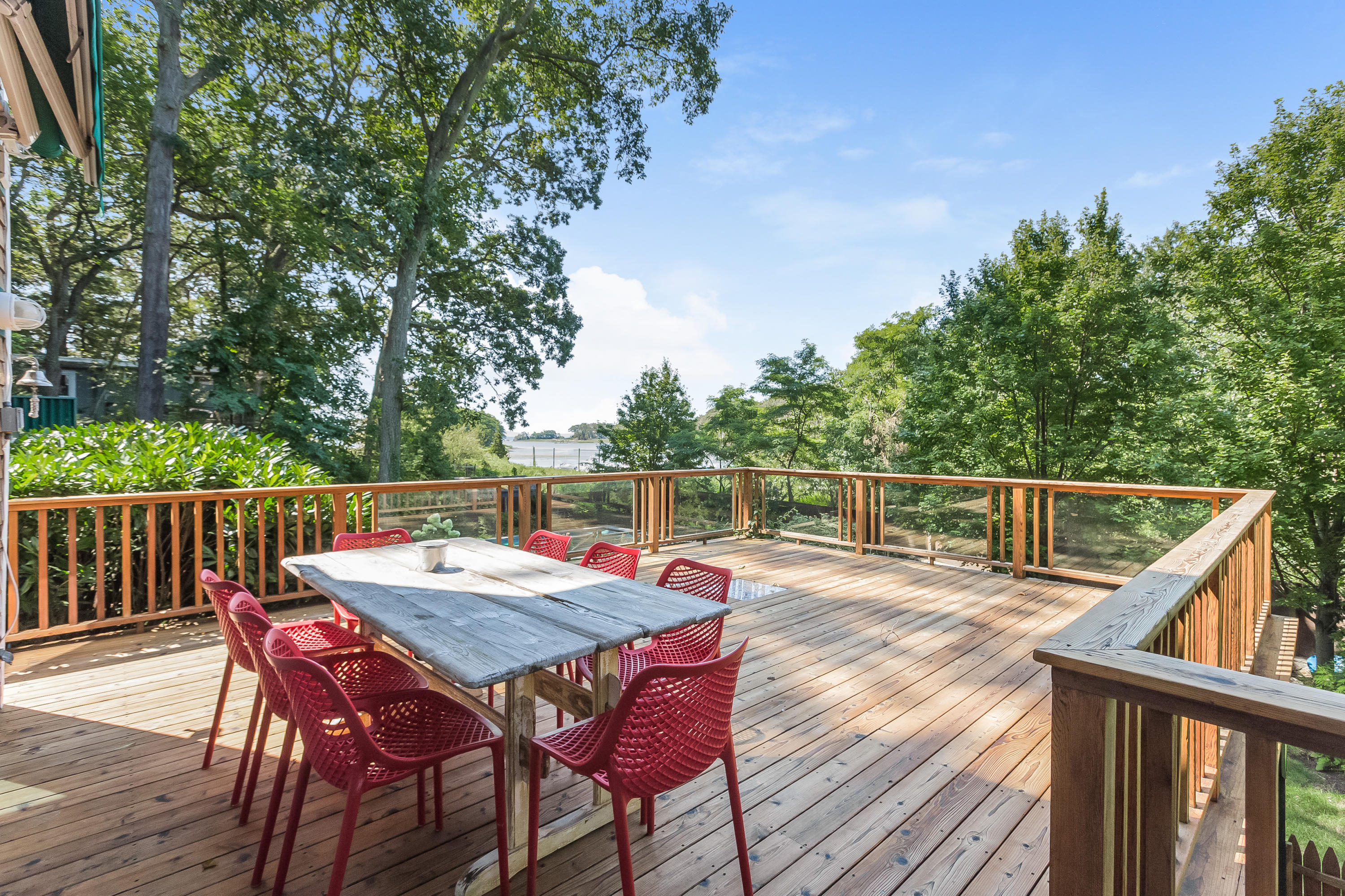 8 Outer Road Norwalk, CT 06854 - Photo 32 of 39 a balcony with wooden floor table and chairs