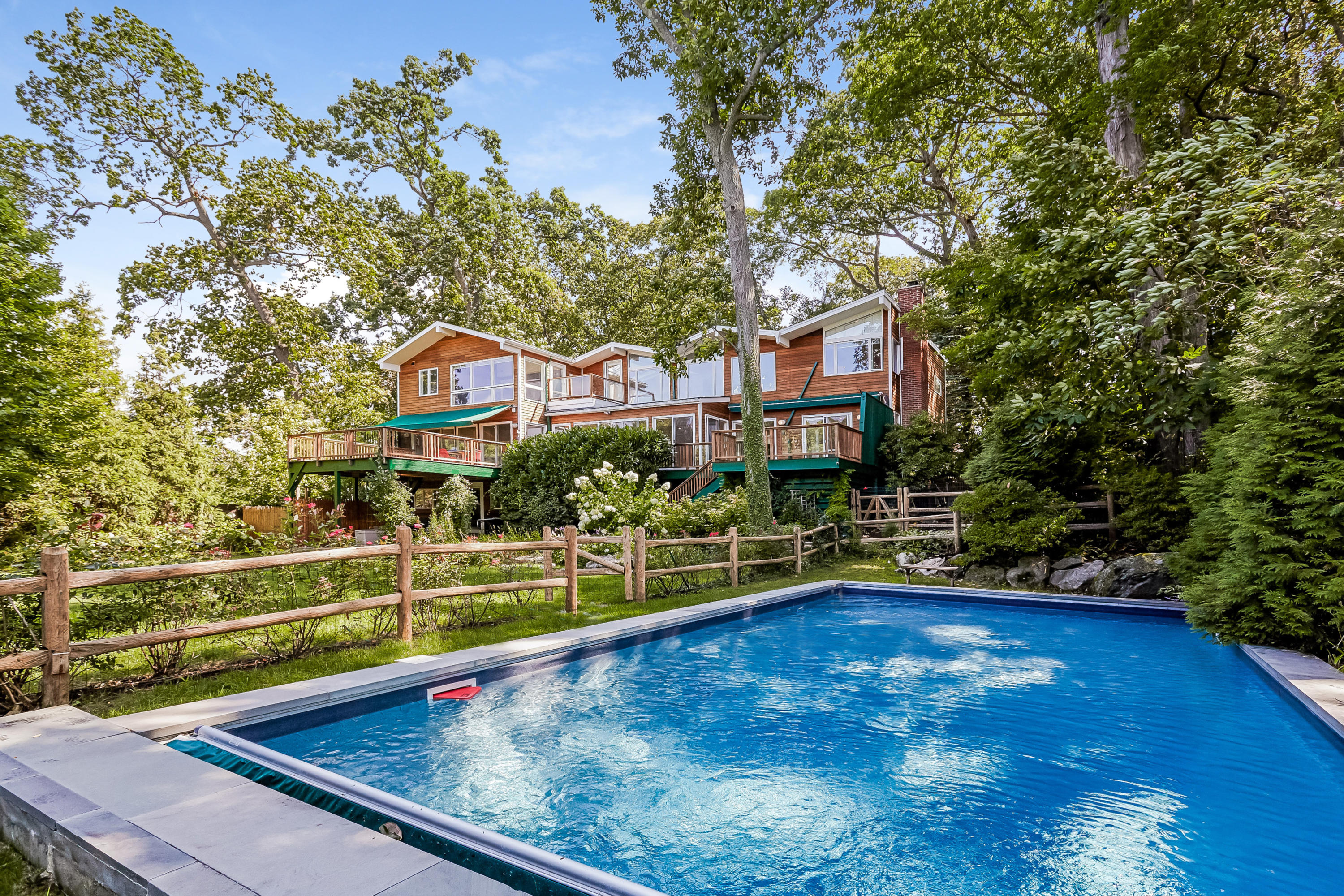 8 Outer Road Norwalk, CT 06854 - Photo 6 of 39 a view of a swimming pool with a lounge chairs