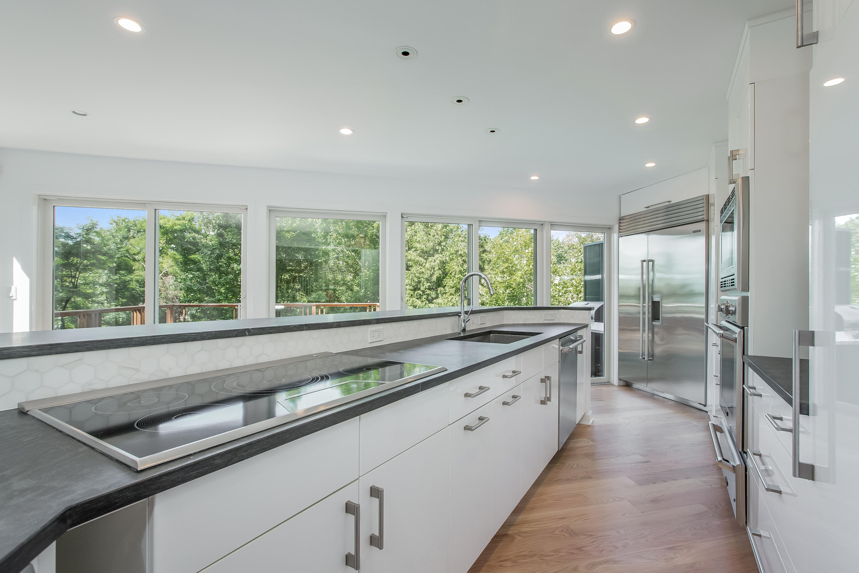 8 Outer Road Norwalk, CT 06854 - Photo 10 of 39 a large kitchen with a large window and refrigerator