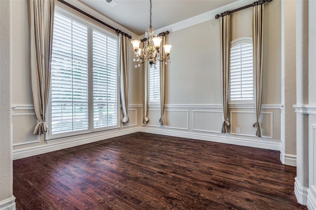 7504 Grace Avenue Plano, TX 75024 - Photo 14 of 36 a view of an empty room with wooden floor and a window