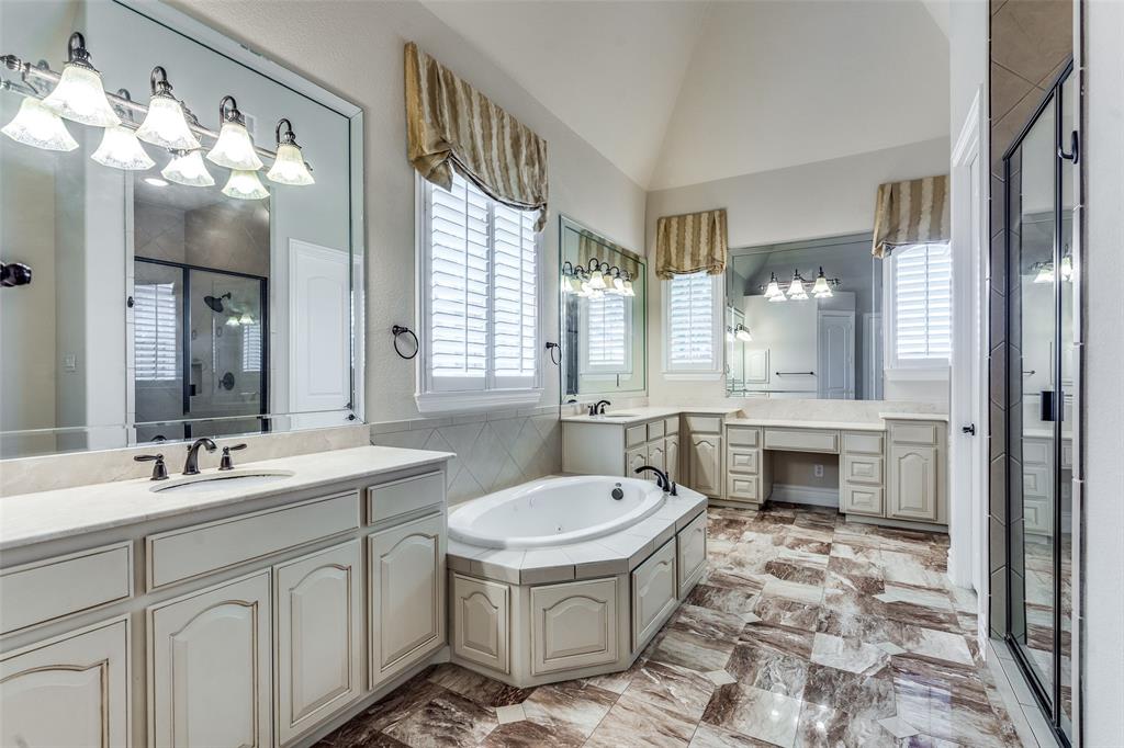 7504 Grace Avenue Plano, TX 75024 - Photo 24 of 36 a bathroom with a sink a toilet and a mirror