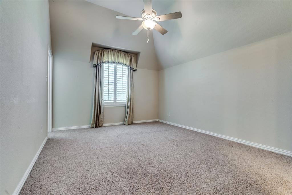7504 Grace Avenue Plano, TX 75024 - Photo 26 of 36 an empty room with windows and fan