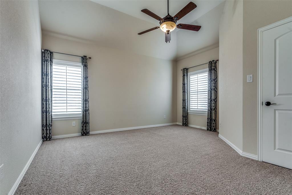 7504 Grace Avenue Plano, TX 75024 - Photo 30 of 36 an empty room with windows and fan