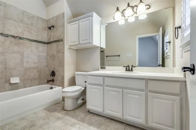 a view of a porch with furniture and garden