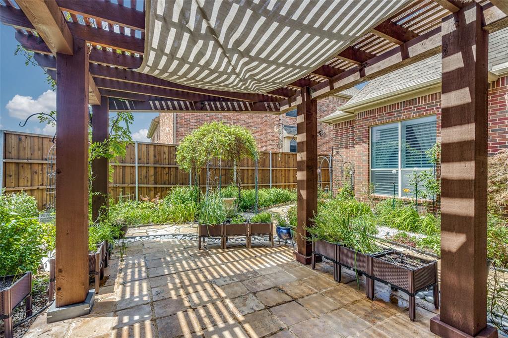 7504 Grace Avenue Plano, TX 75024 - Photo 32 of 36 a view of a porch with furniture and garden
