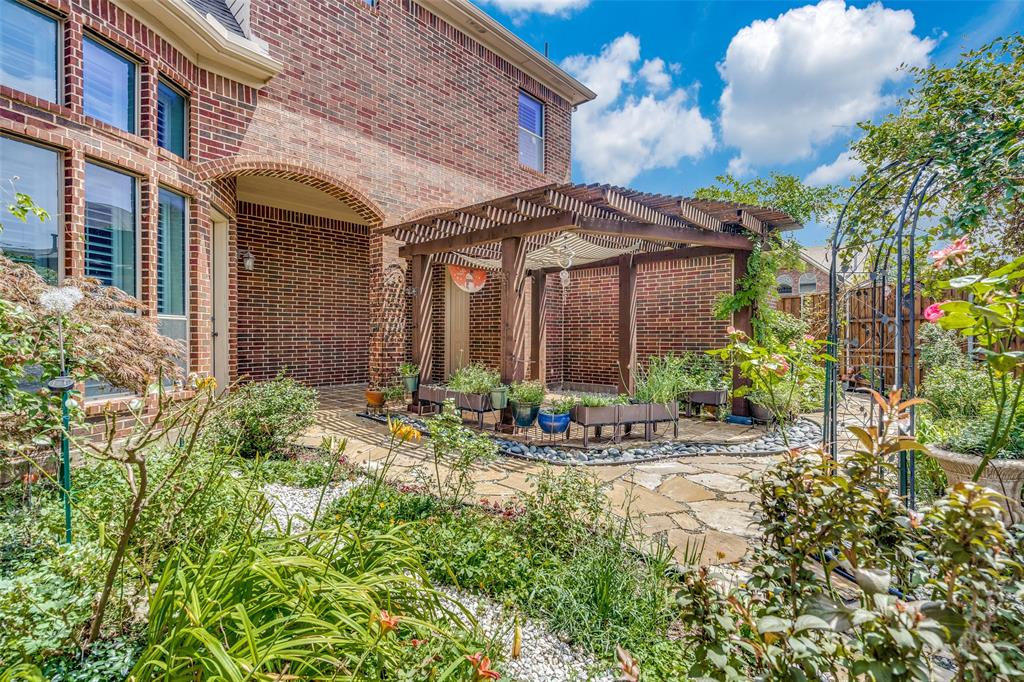 7504 Grace Avenue Plano, TX 75024 - Photo 35 of 36 a view of a building with a yard and sitting area