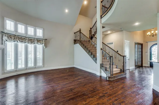 a view of an entryway with wooden floor