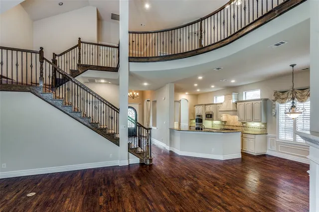a view of a kitchen and wooden floor