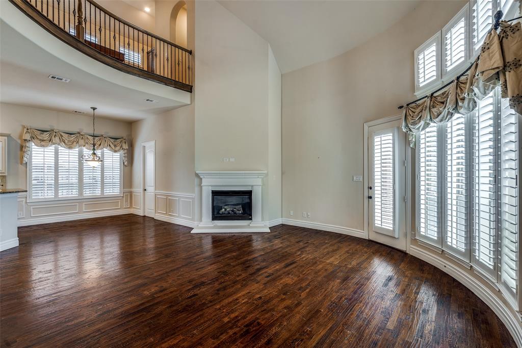 7504 Grace Avenue Plano, TX 75024 - Photo 6 of 36 a view of an empty room with wooden floor and a window