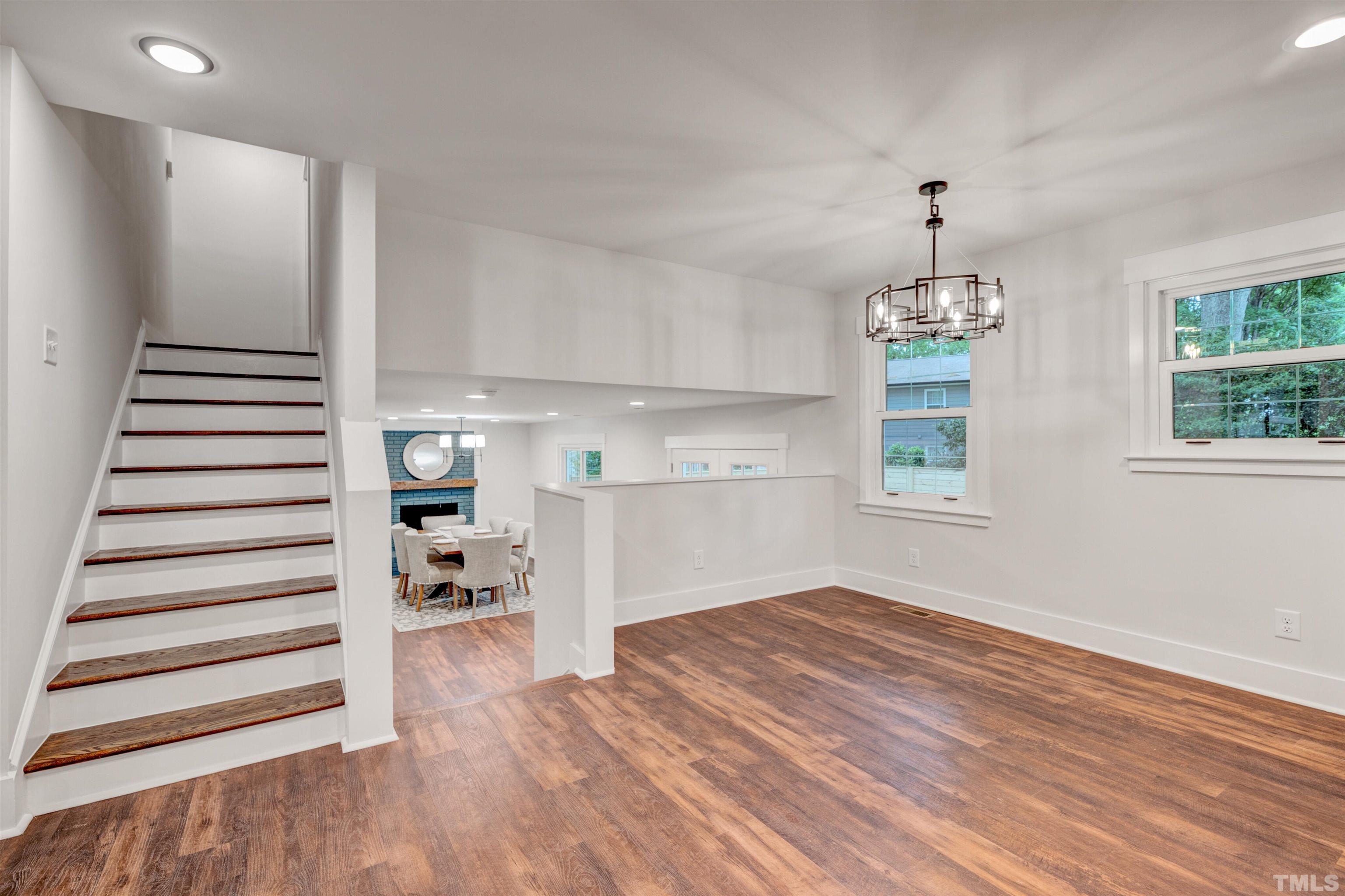 5400 Farley Drive Raleigh, NC 27609 - Photo 11 of 31 a view of empty room with wooden floor and window