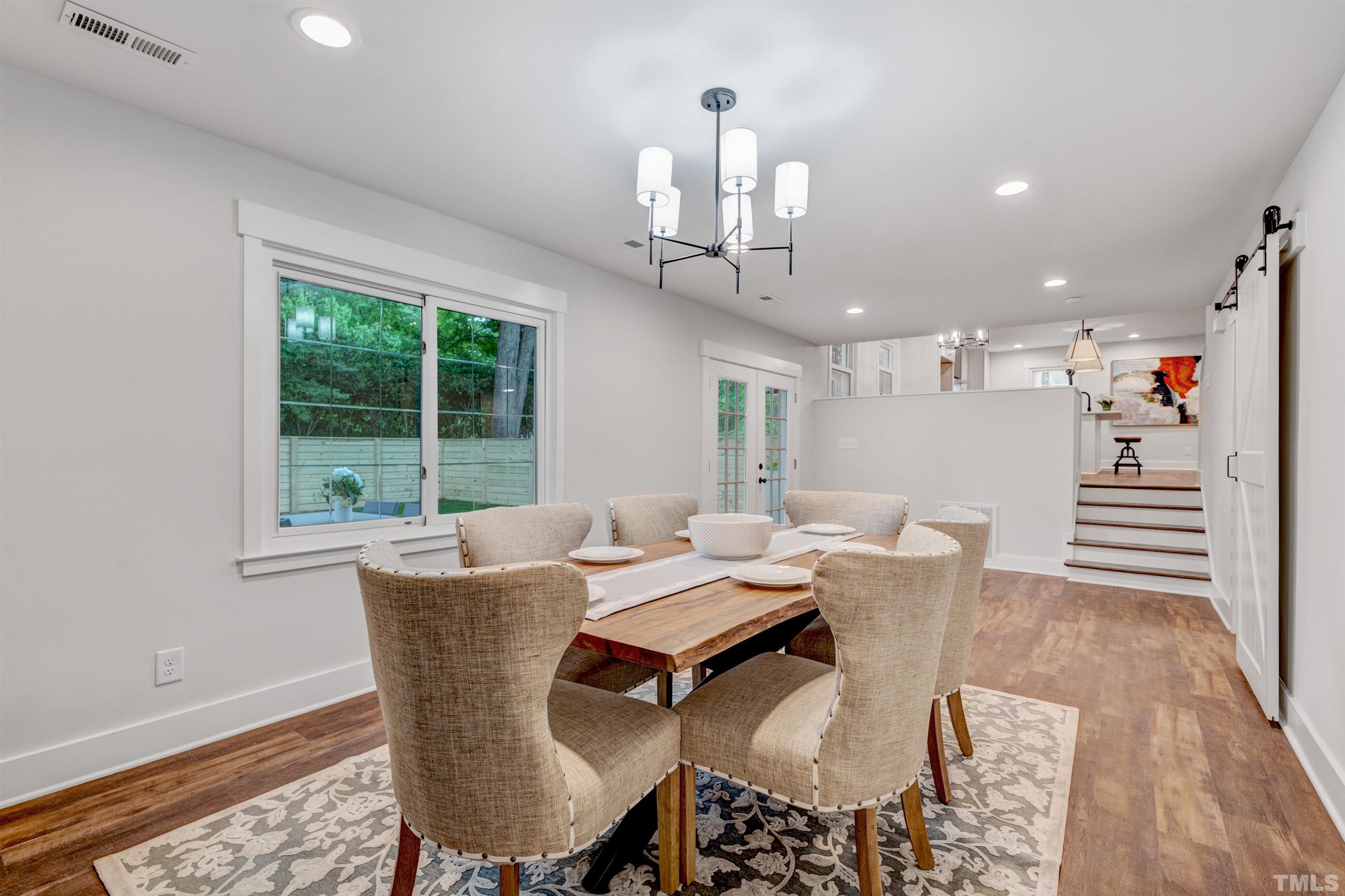 5400 Farley Drive Raleigh, NC 27609 - Photo 13 of 31 a view of a dining room with furniture window and outside view
