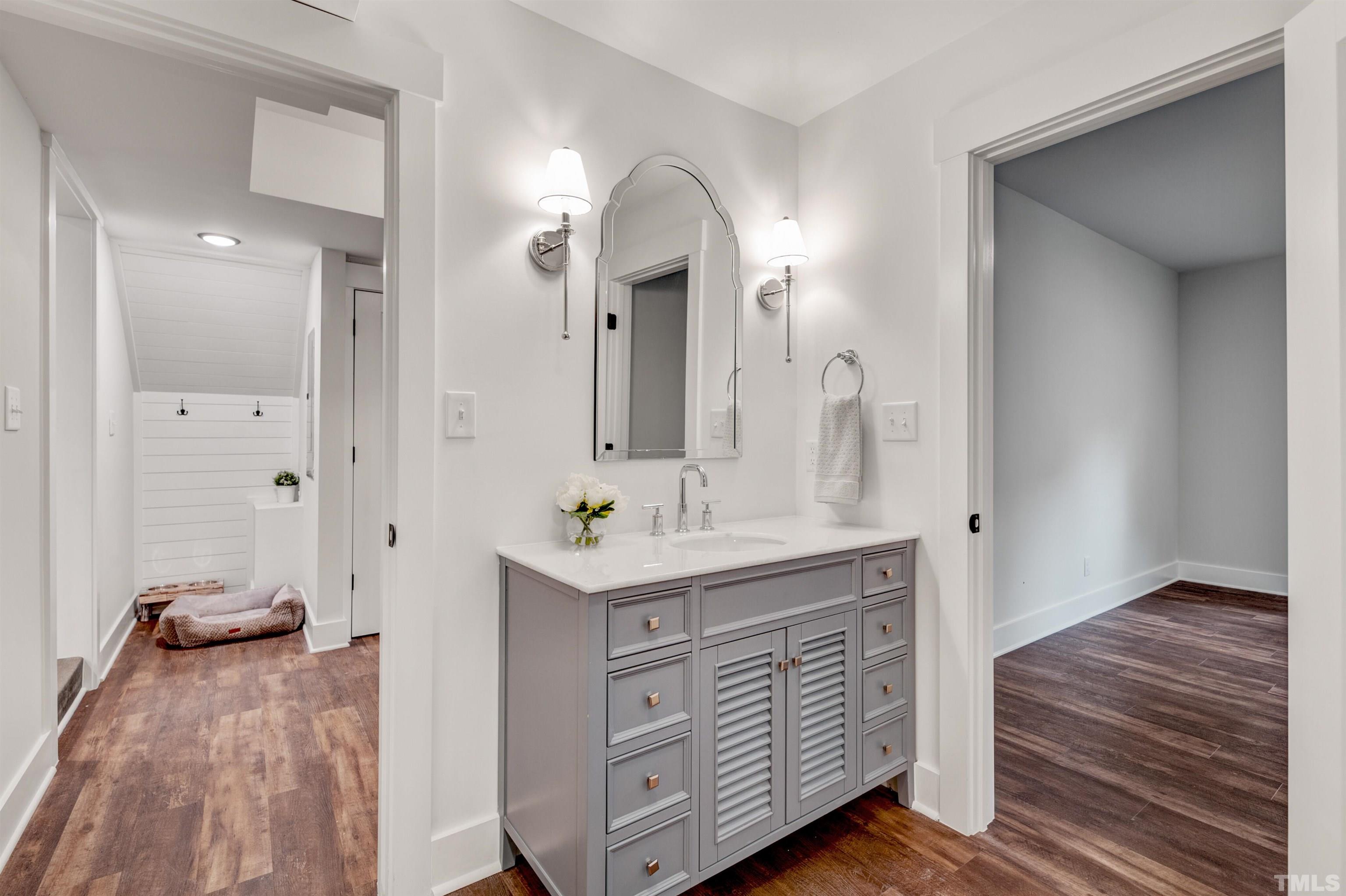 5400 Farley Drive Raleigh, NC 27609 - Photo 17 of 31 a spacious bathroom with a double vanity sink and a mirror