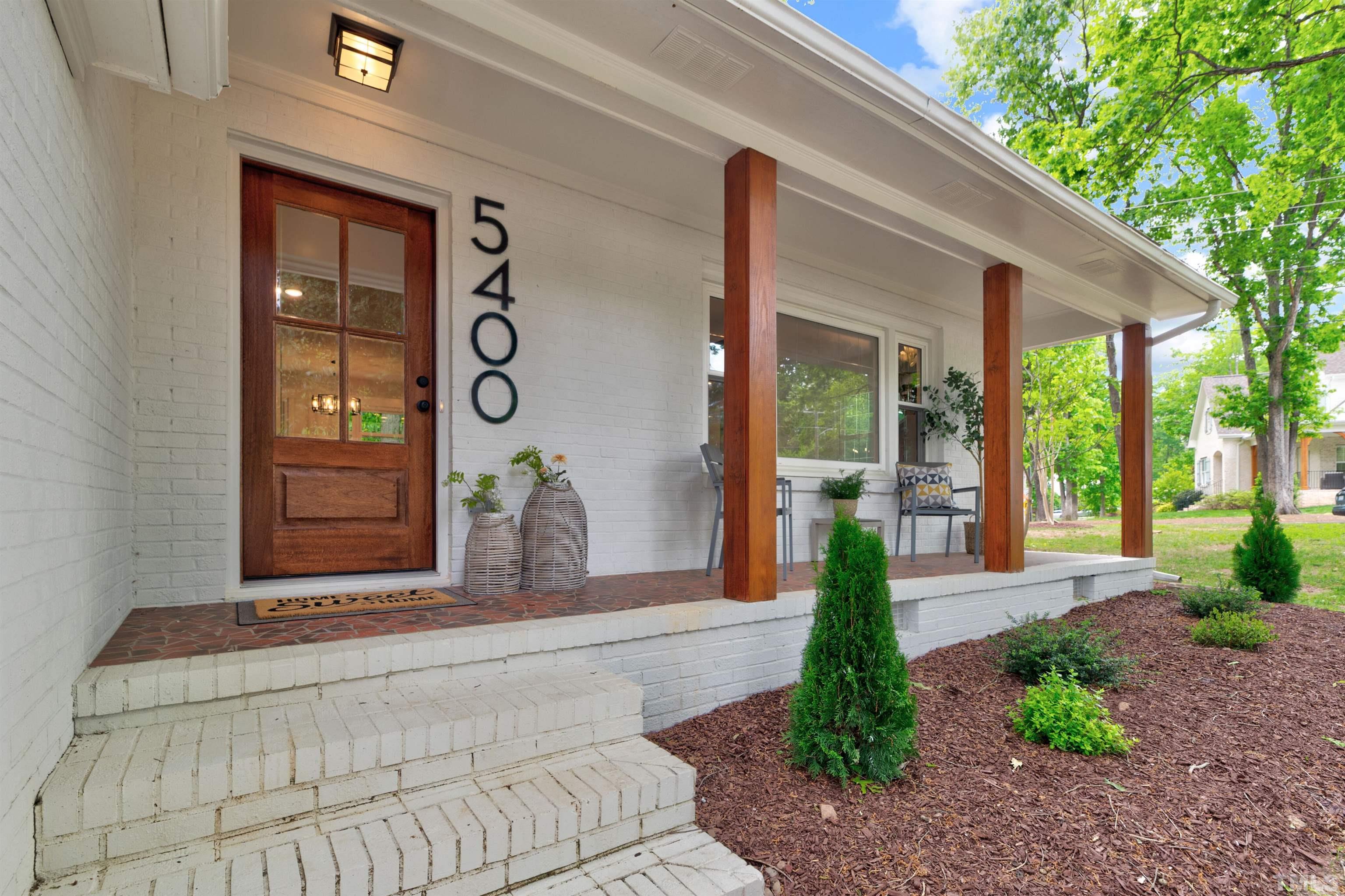 5400 Farley Drive Raleigh, NC 27609 - Photo 2 of 31 a front view of a house with garden