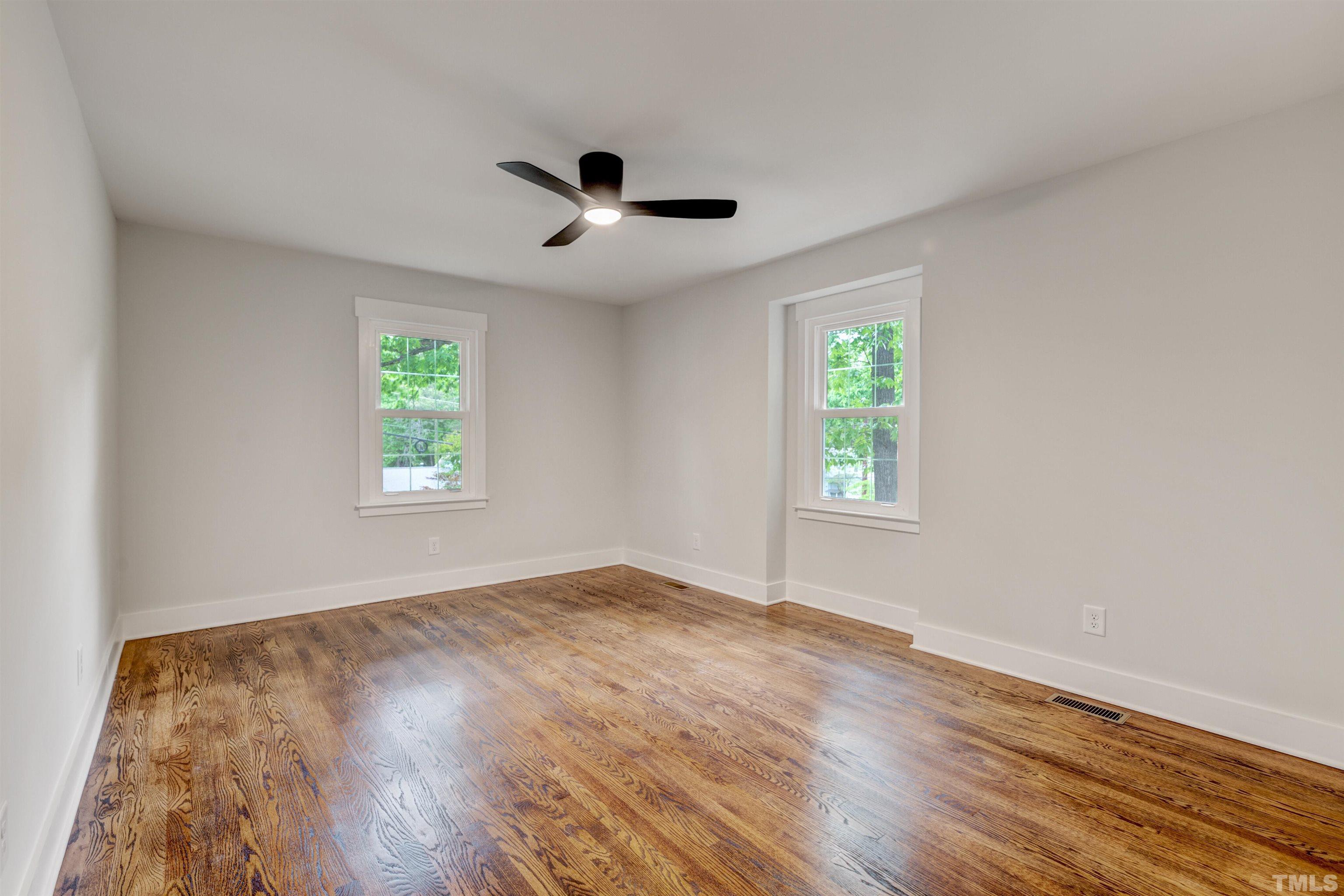 5400 Farley Drive Raleigh, NC 27609 - Photo 23 of 31 a view of an empty room with wooden floor and a window