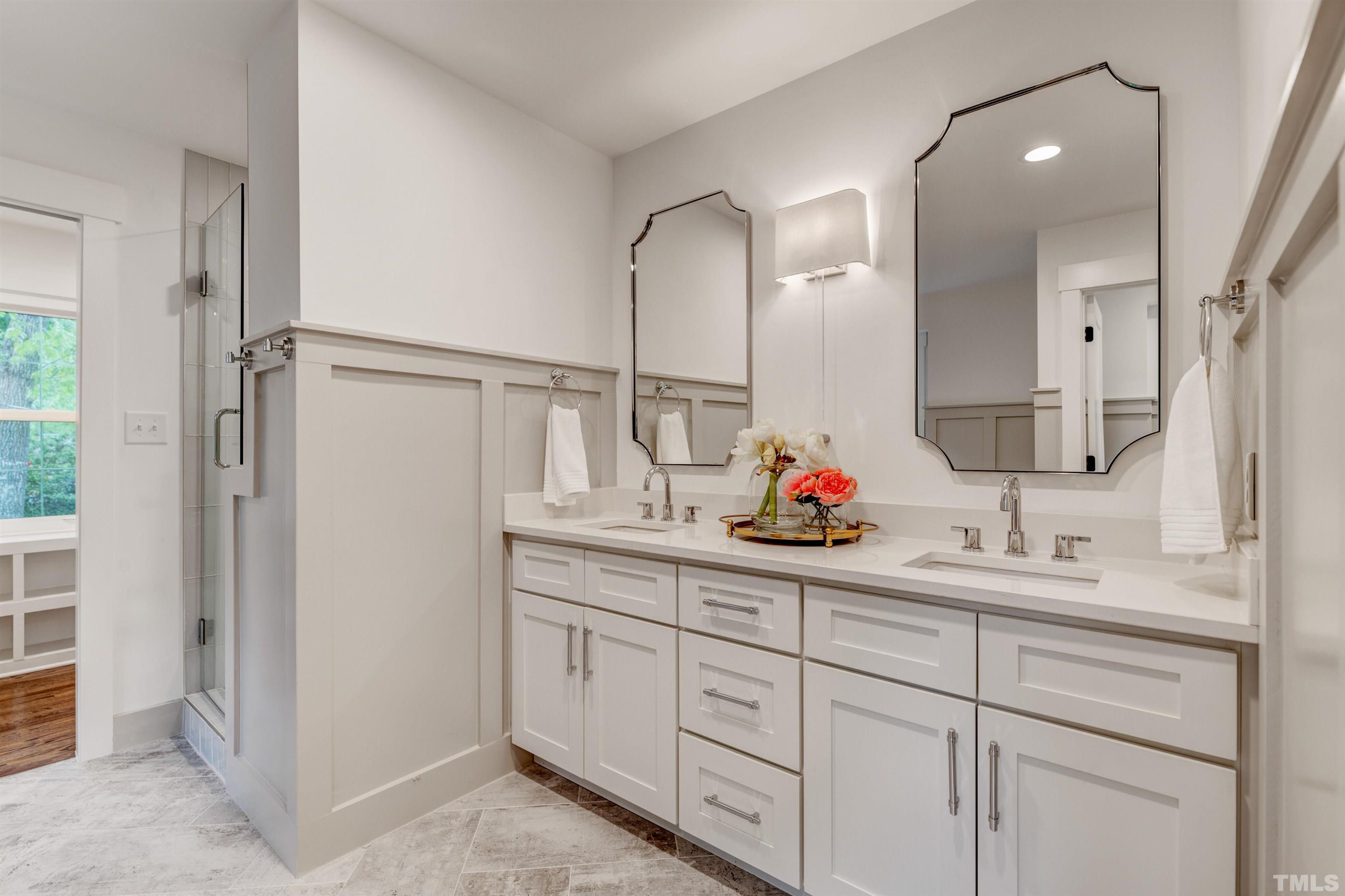 5400 Farley Drive Raleigh, NC 27609 - Photo 25 of 31 a bathroom with a double vanity sink and mirror